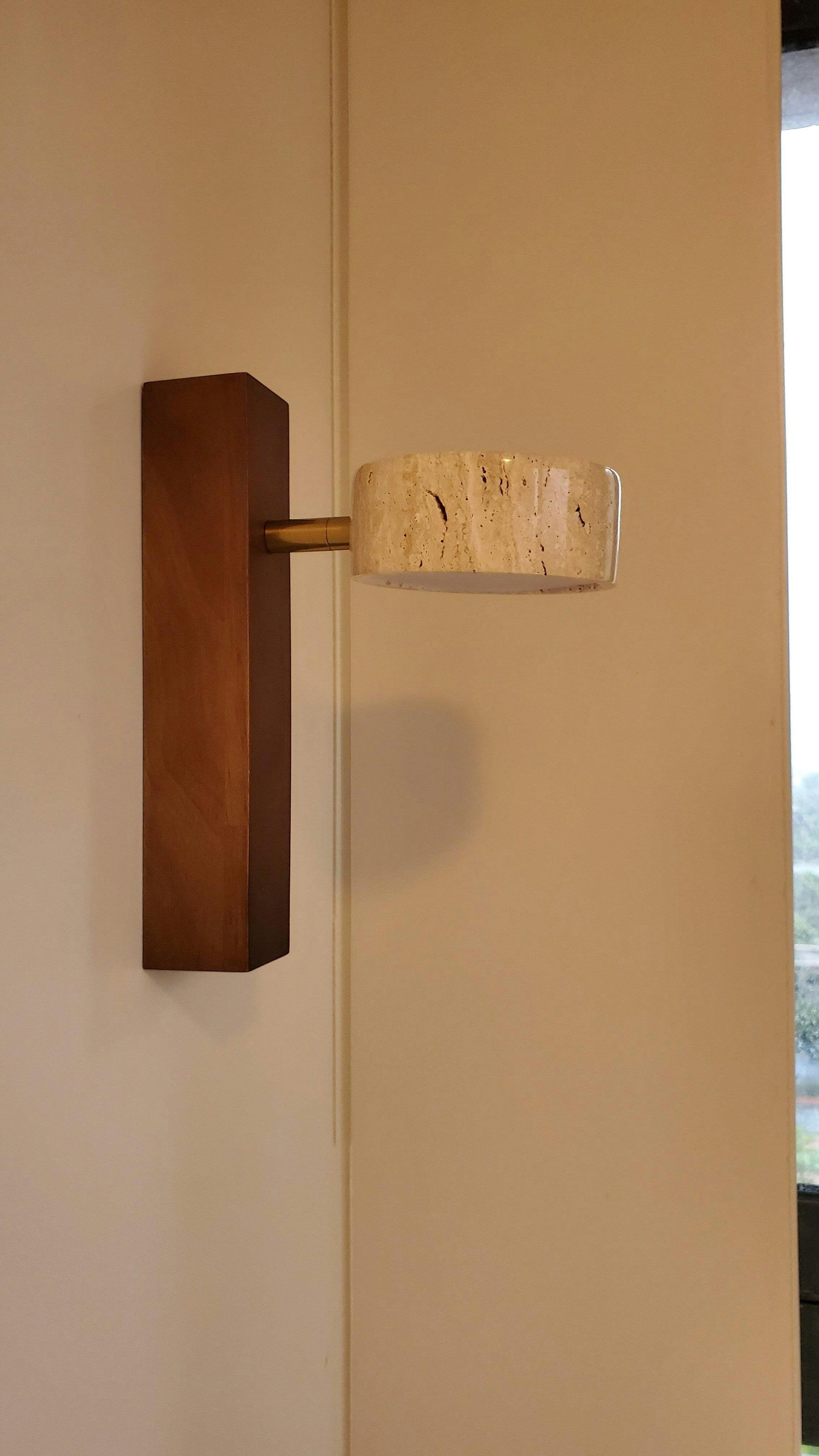 Side view of stone shade and short connection to wooden wallplate