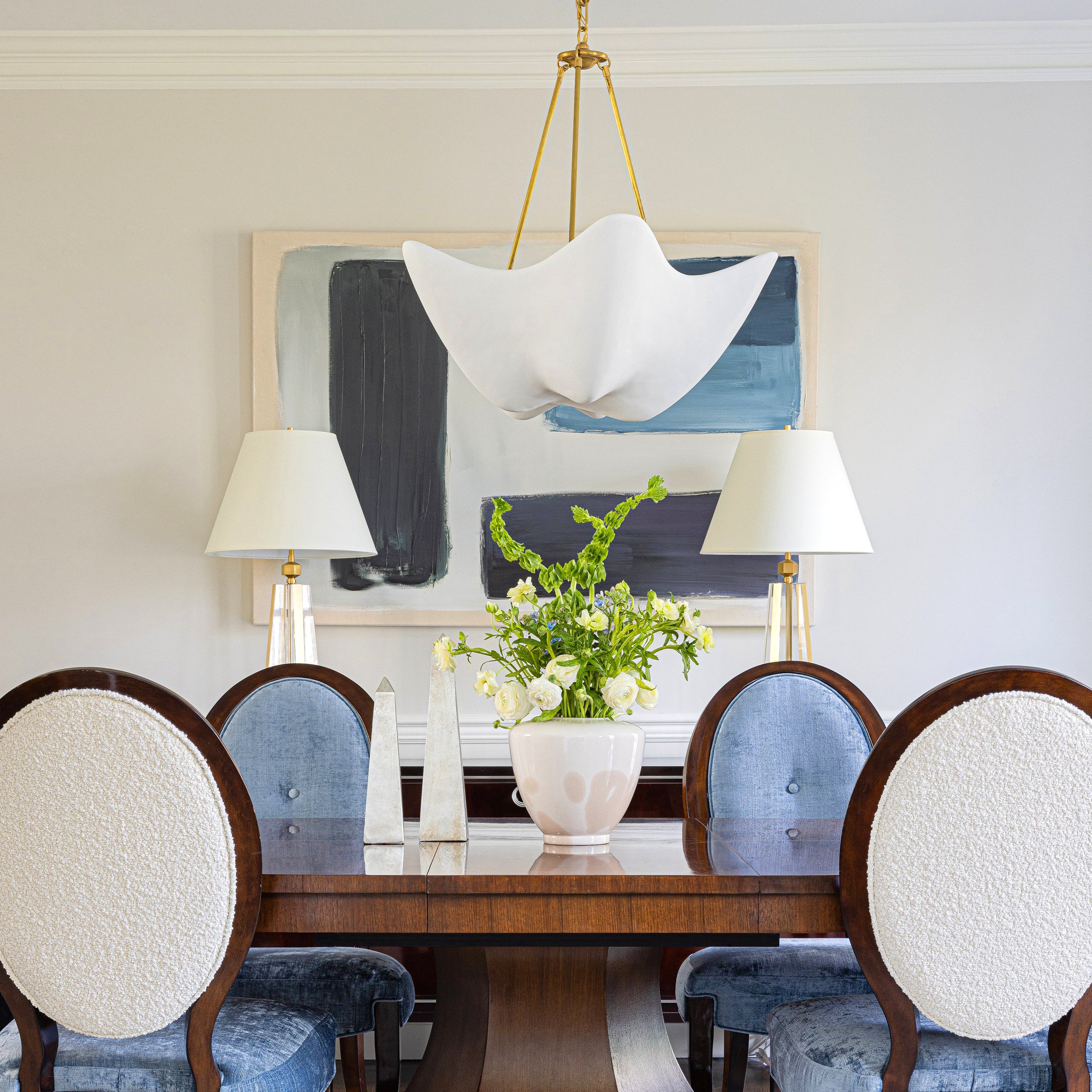 Antique Brass Cosima chandelier above a dining table