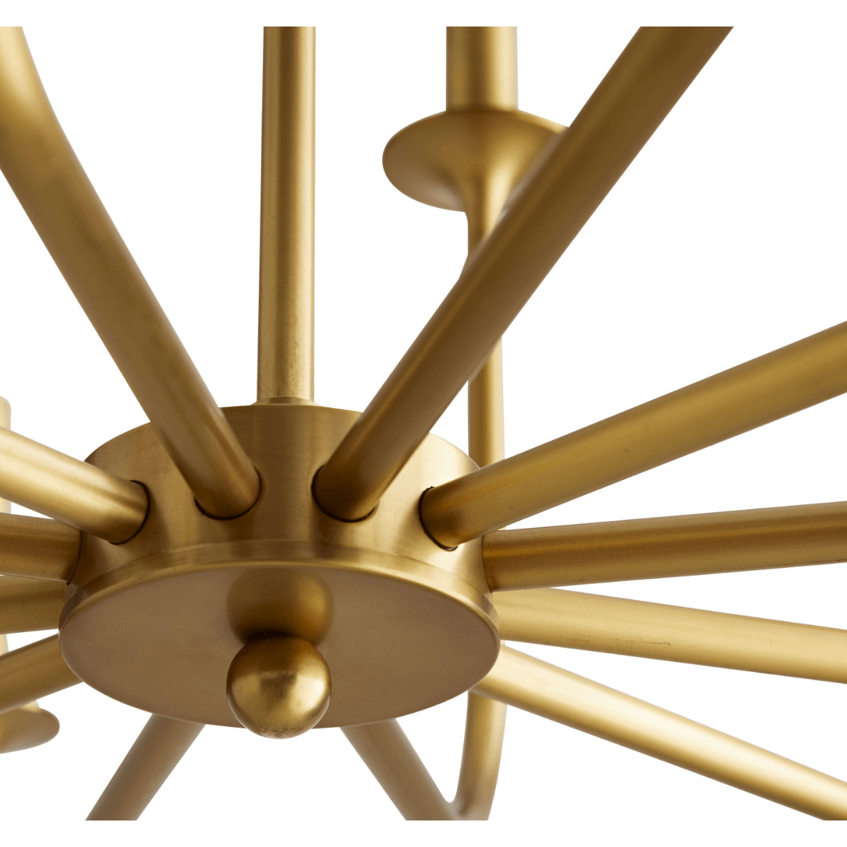 Close view of a gold central hub, round finial and radiating curved chandelier arms