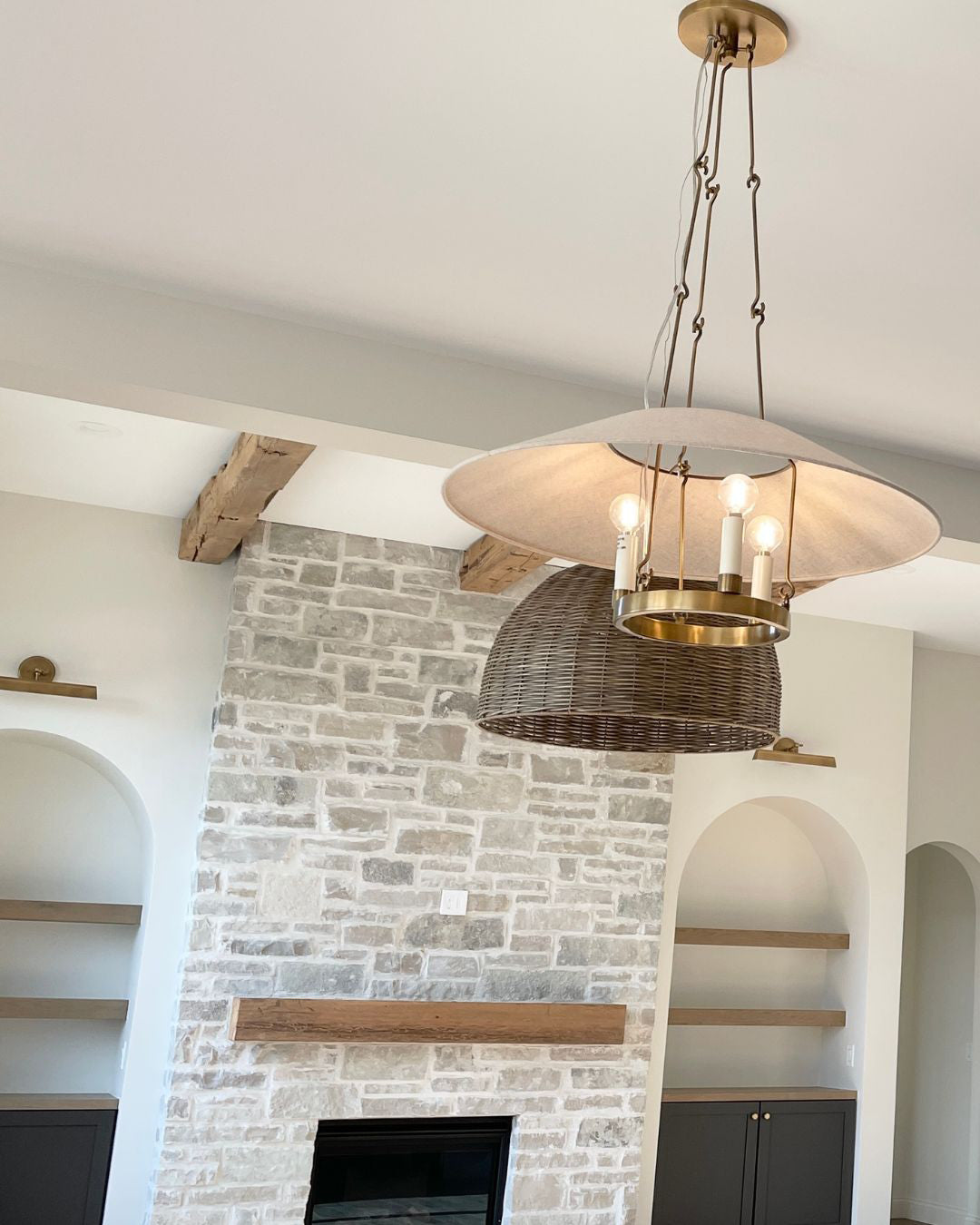 Troy Archive chandelier near a kitchen fireplace