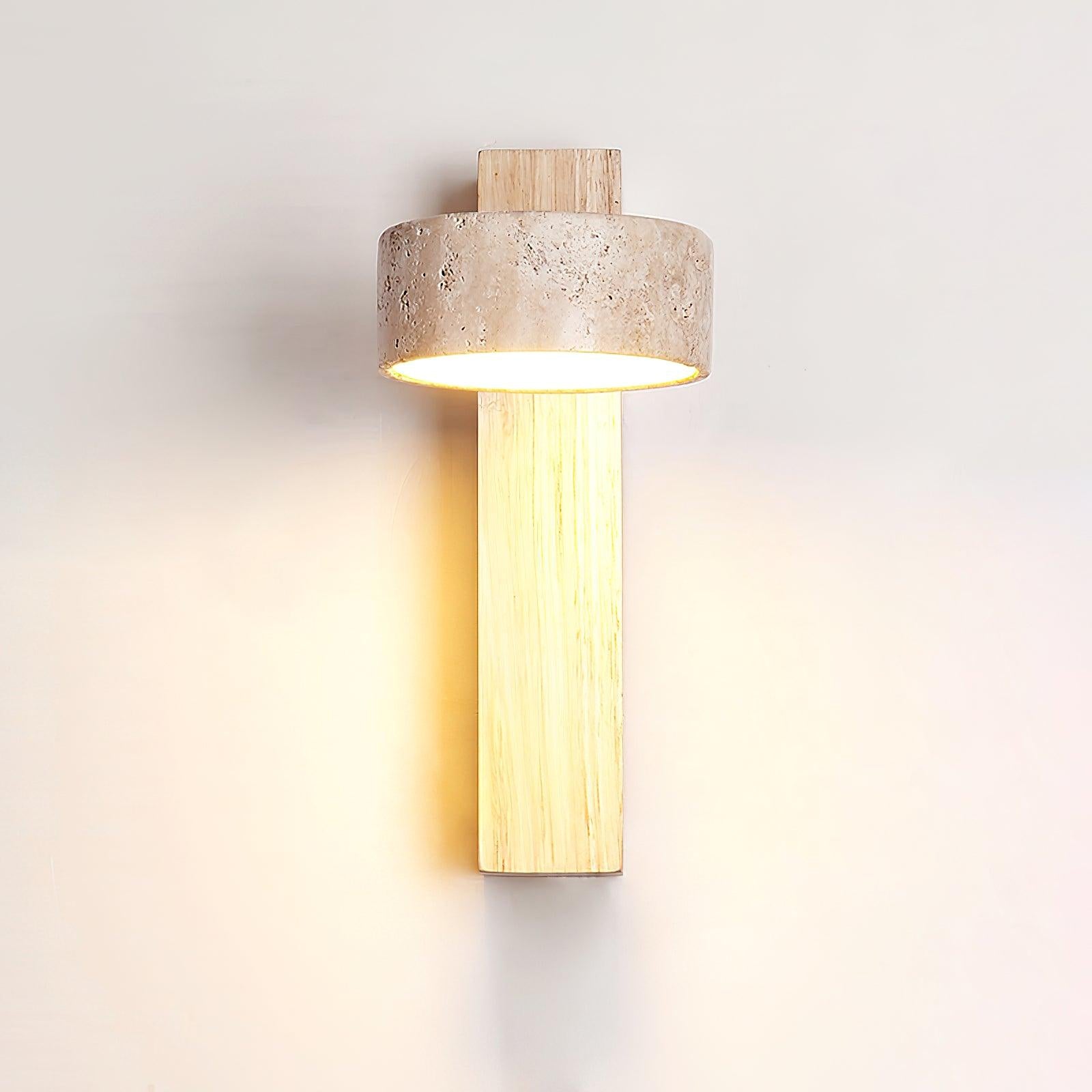 Light wood-colour wall lamp shown casting light down its wooden plate