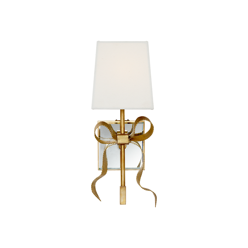 Front view of Antique Brass bow wall light with pale linen shade, textured loops and long curling ribbon tails