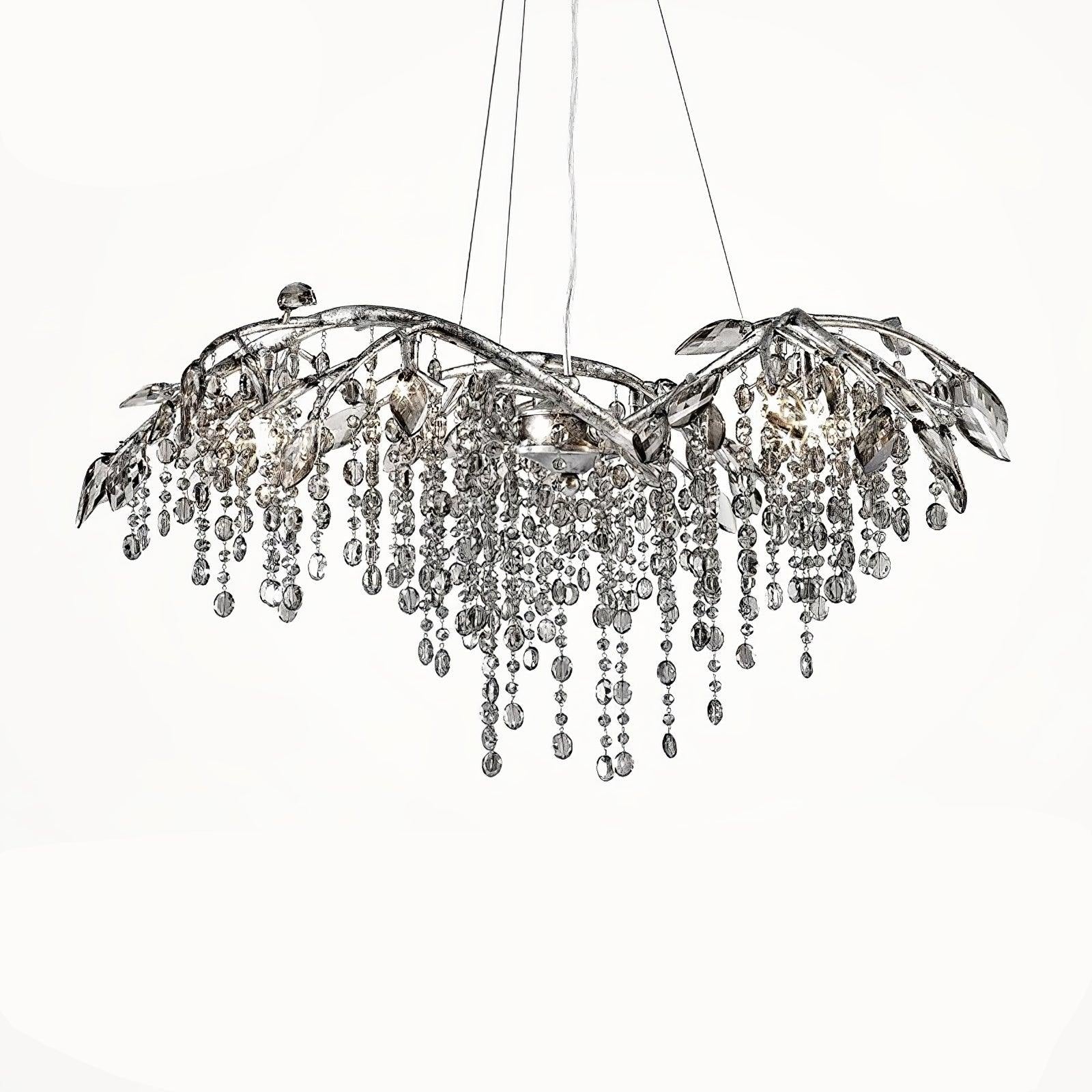 Broad shallow silver-tone branch chandelier with leaf ornaments, hanging beads, glowing lamps and suspension wires