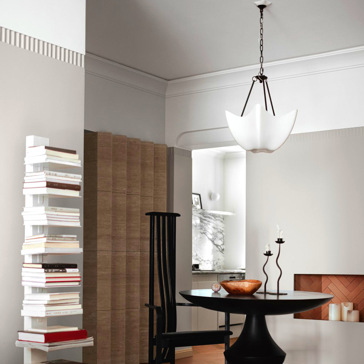 Antique Black Cosima chandelier above a round table