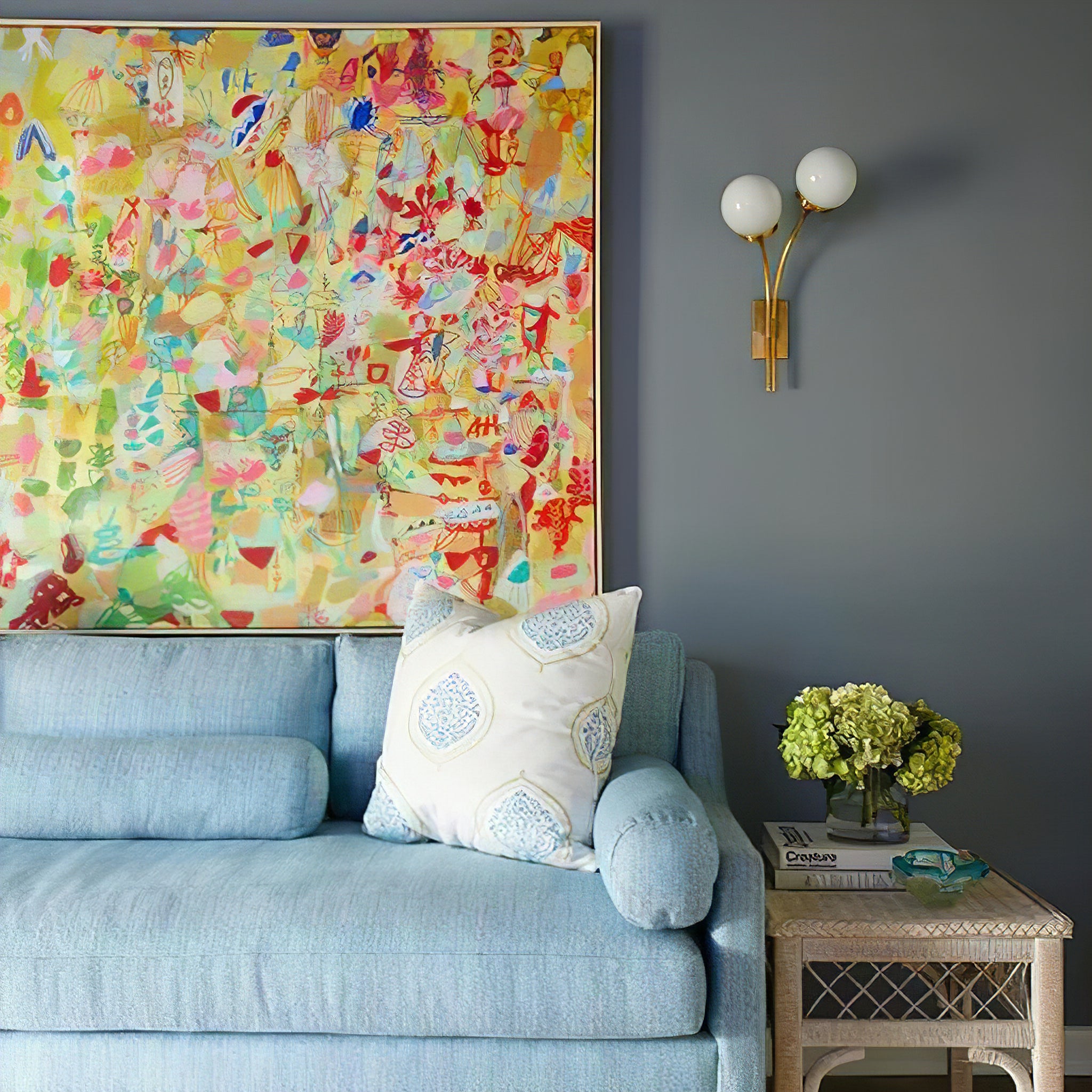 Brass and white-glass sconce above a sofa