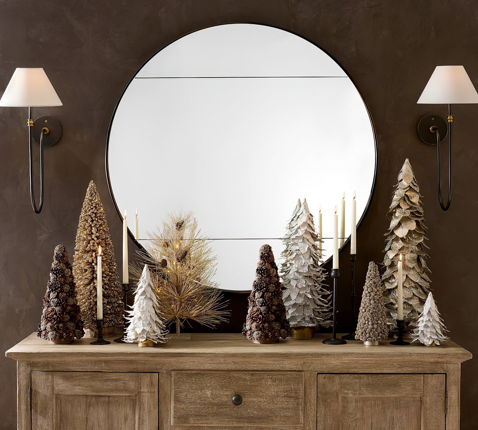 Two Collins wall lamps flanking a round mirror