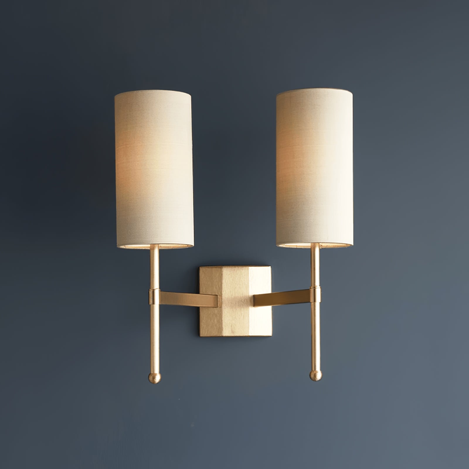 Silk Double Rod two-head wall lamp illuminated on a dark wall