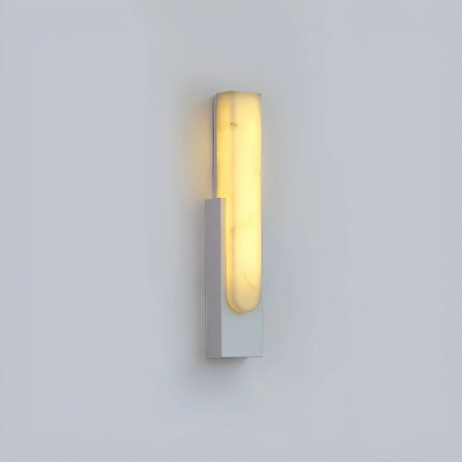 White single wall sconce on pale background
