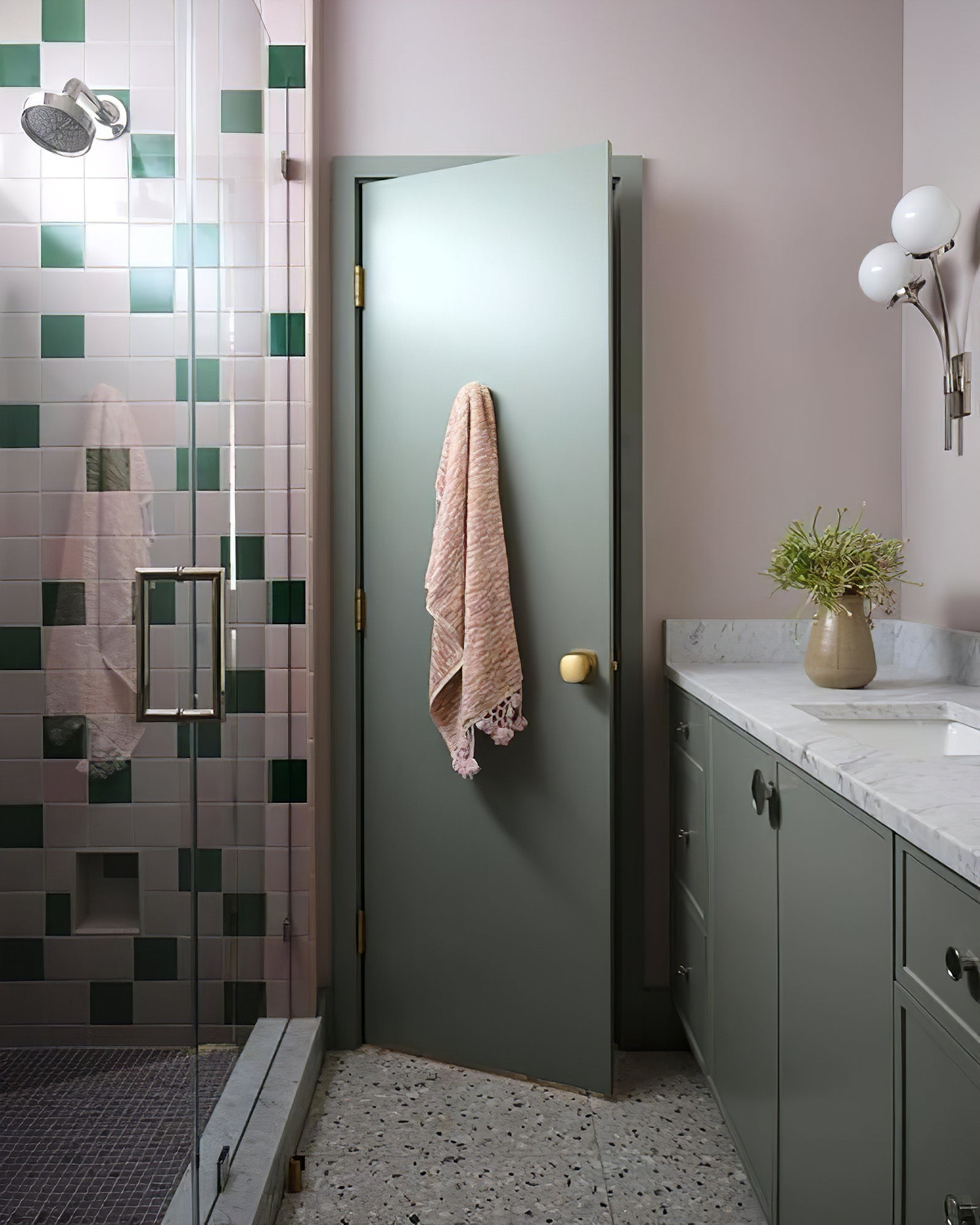 Nickel white-glass sconces in a bathroom setting