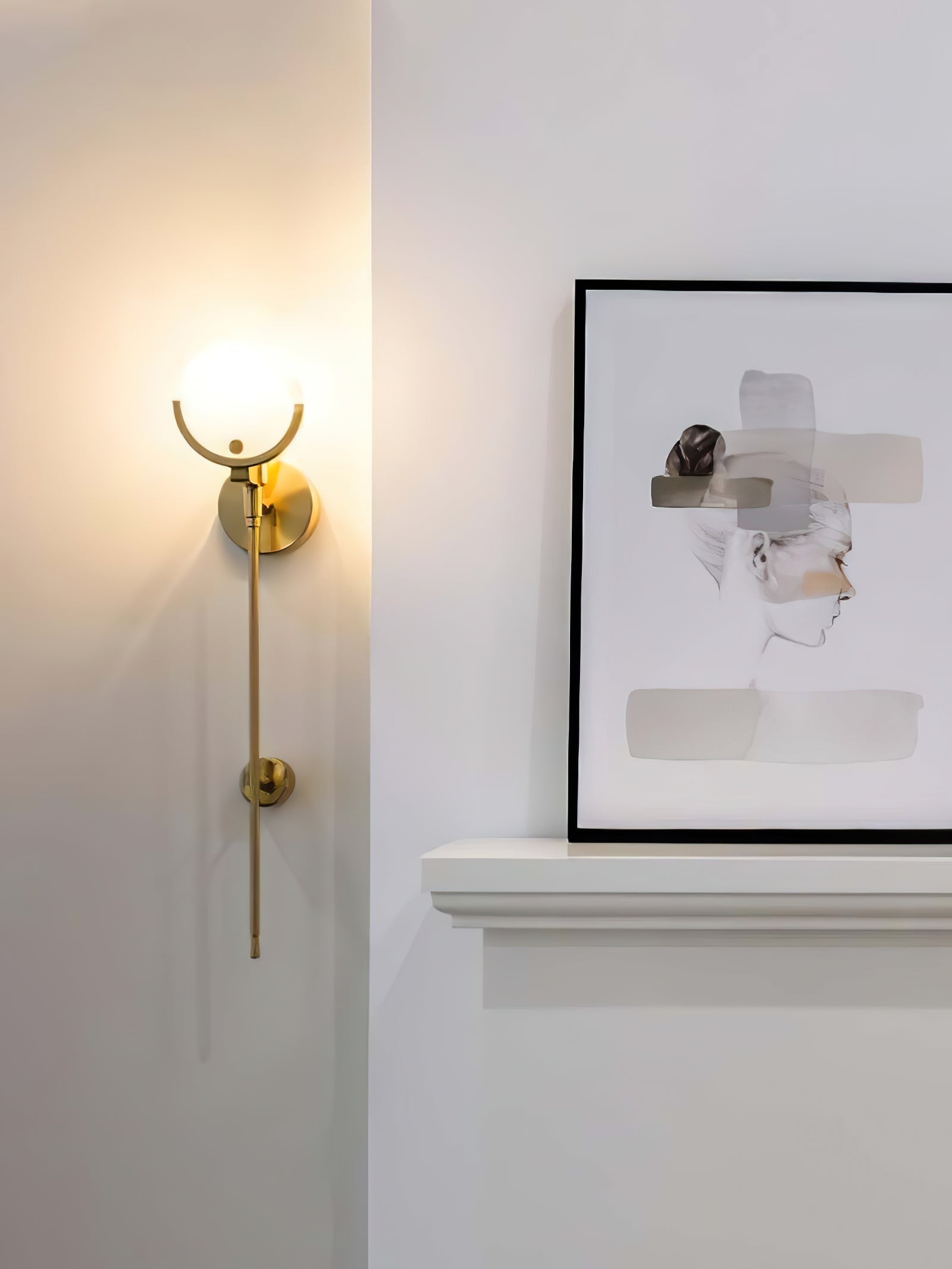 Universal Ava wall light beside framed artwork in an alternate crop