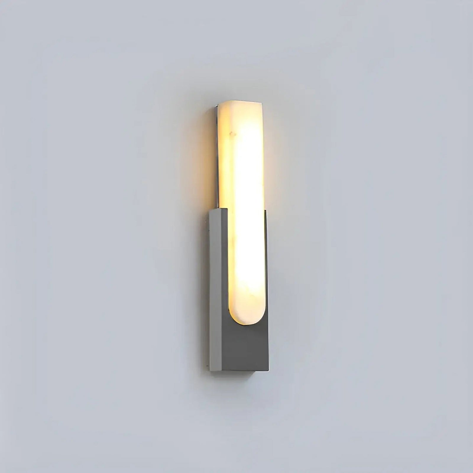 Gray single wall sconce on pale background