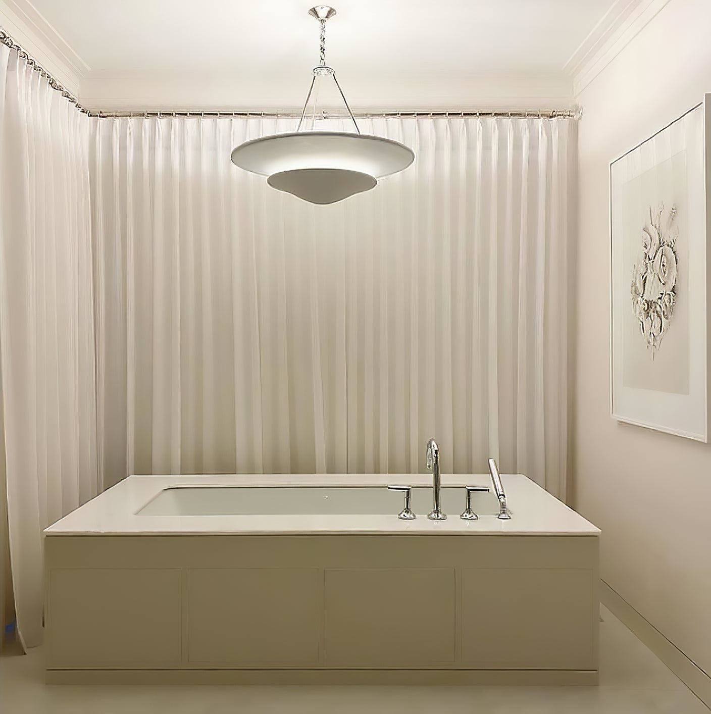 White Mollino two-tier chandelier with silver-tone suspension pictured above bathtub with taps and curtains