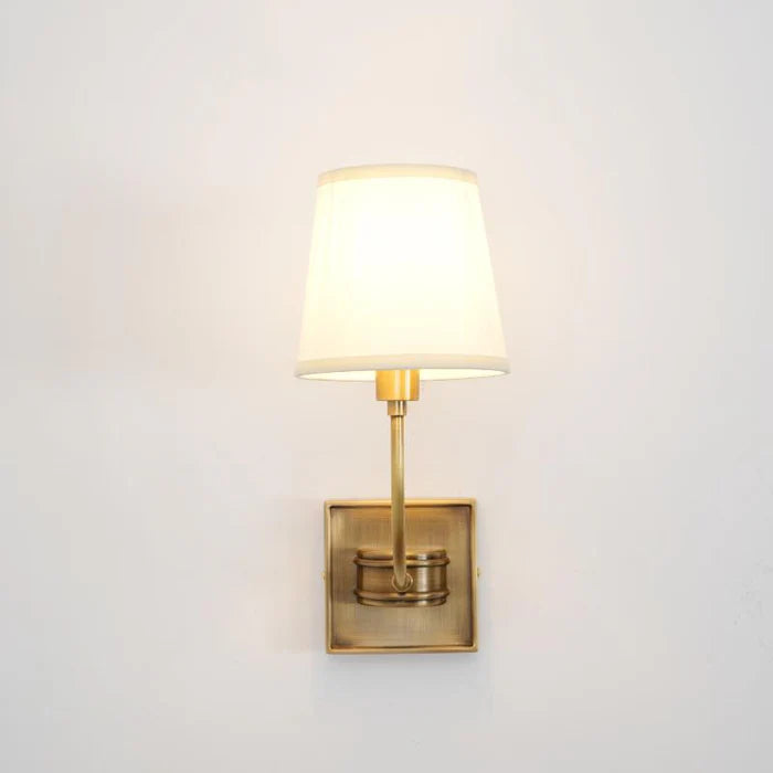 Illuminated Vendome single lamp with a square brass backplate.