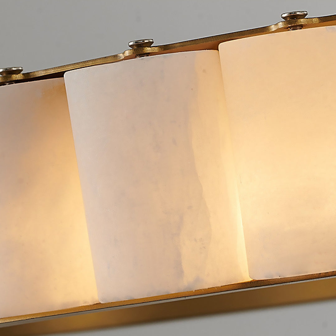 Close pale veined segment faces between gold-tone edges with small upper fixing screws