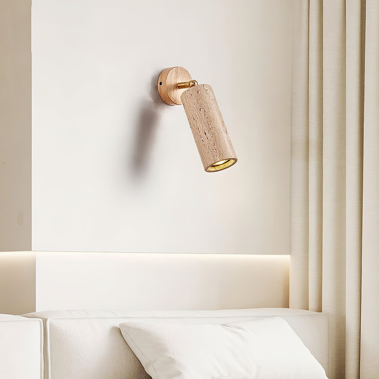 Mireille light wood-colour pivot wall lamp beside a bed