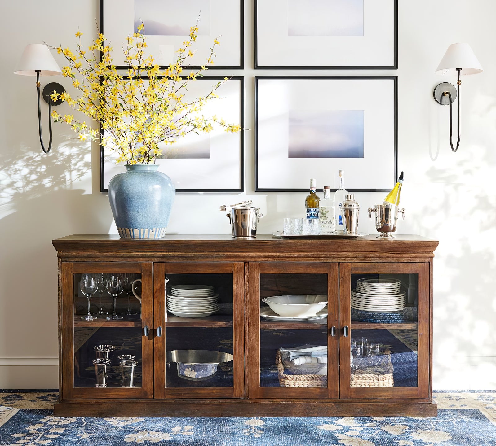 Pair of Collins shaded wall lights above a wooden sideboard