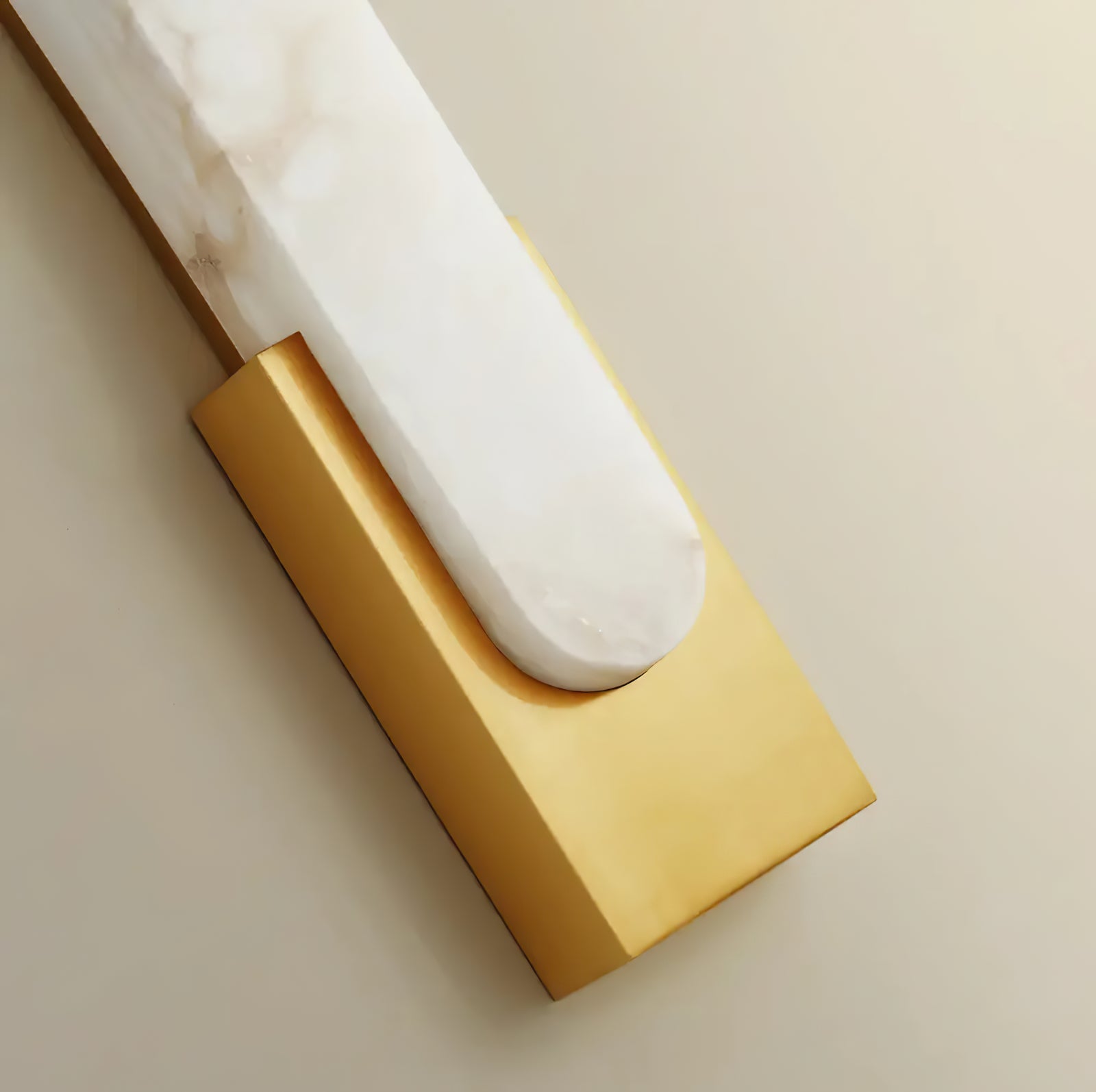 Close view of gold backplate and pale insert