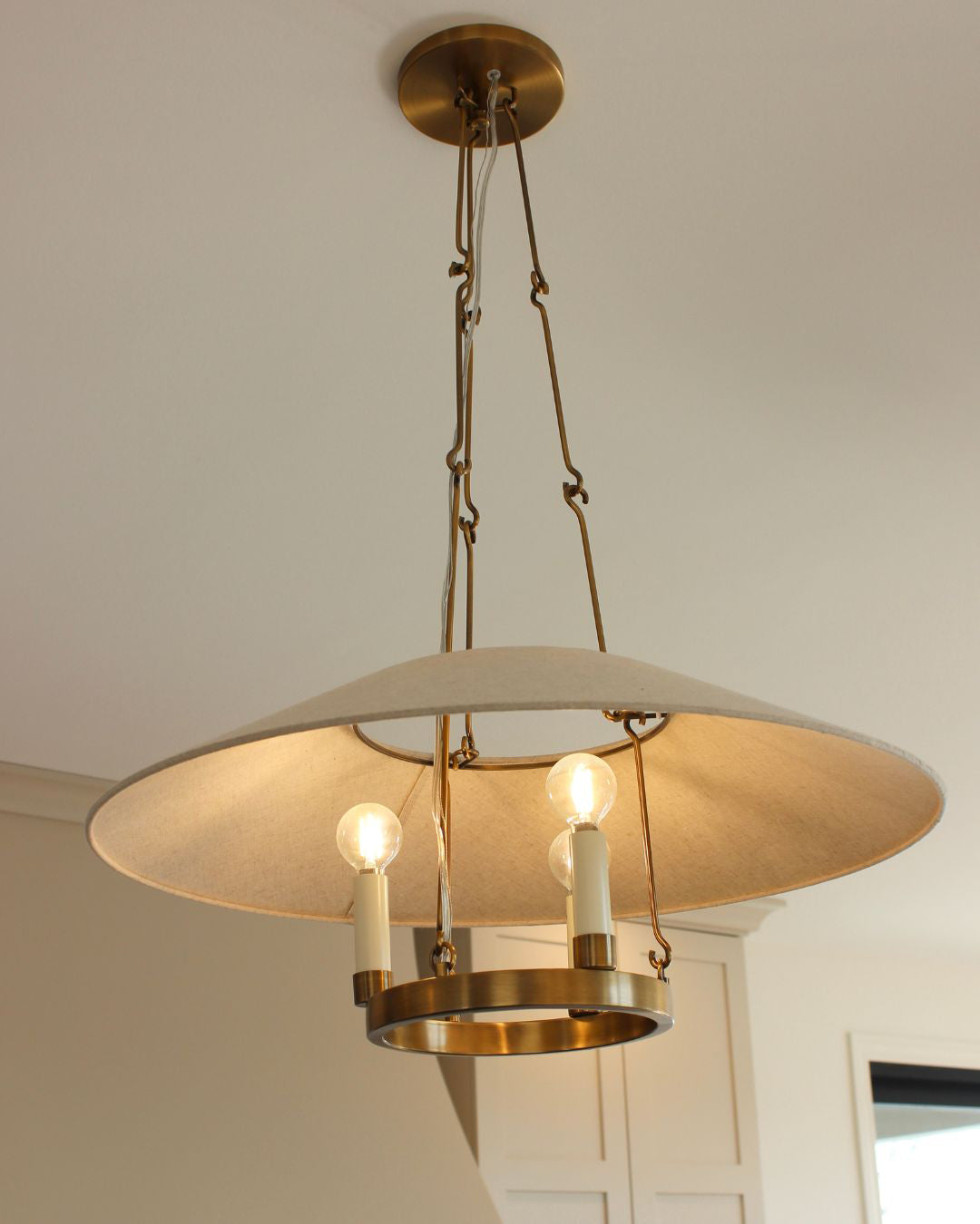 Illuminated Troy Archive shade, candle-style lights and hanging supports