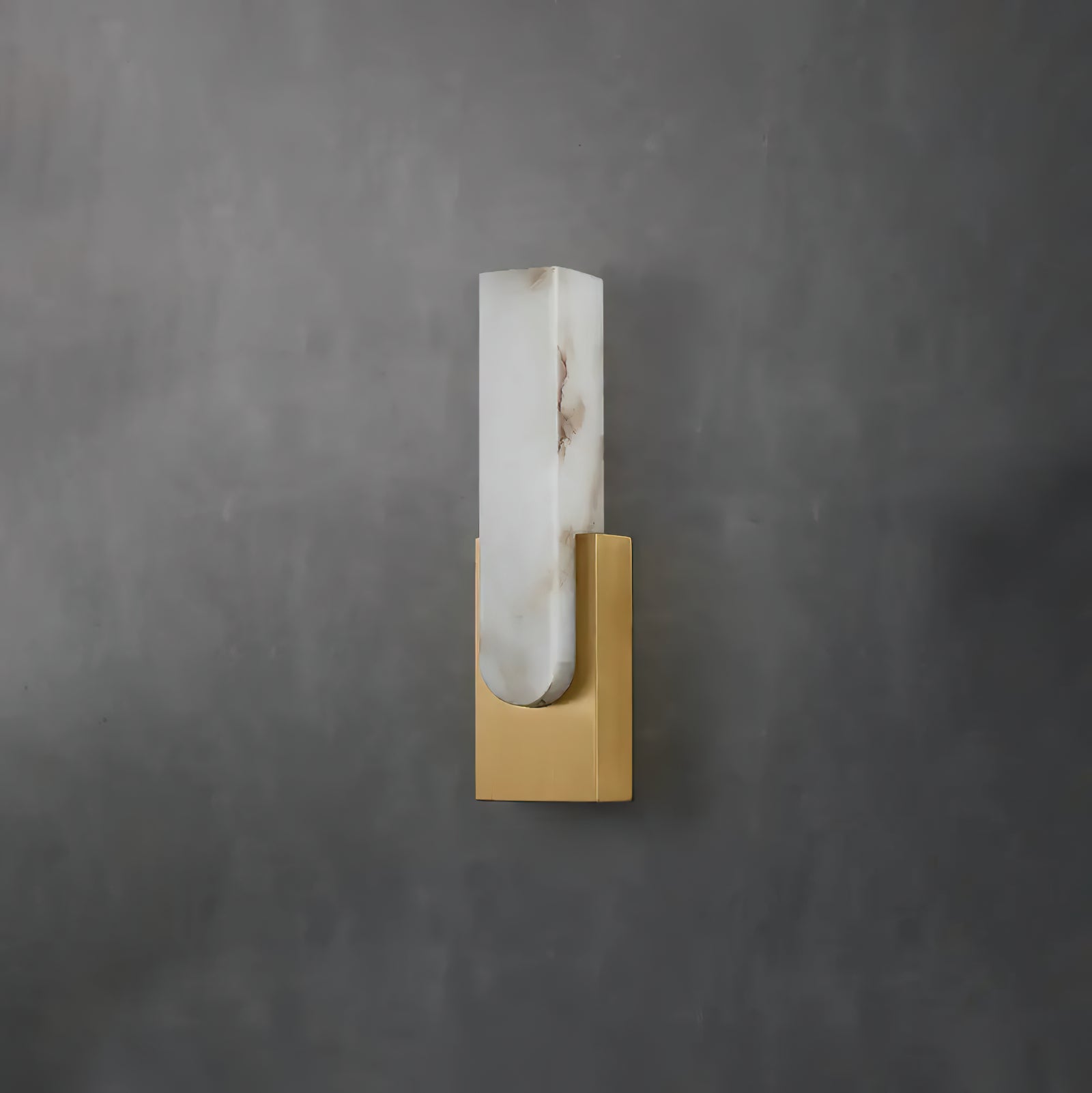 Unlit gold wall sconce showing veined pale insert