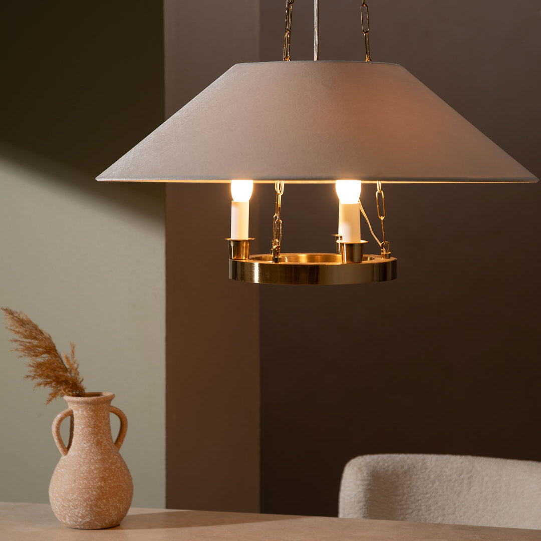 Troy Archive chandelier above a table against a dark wall