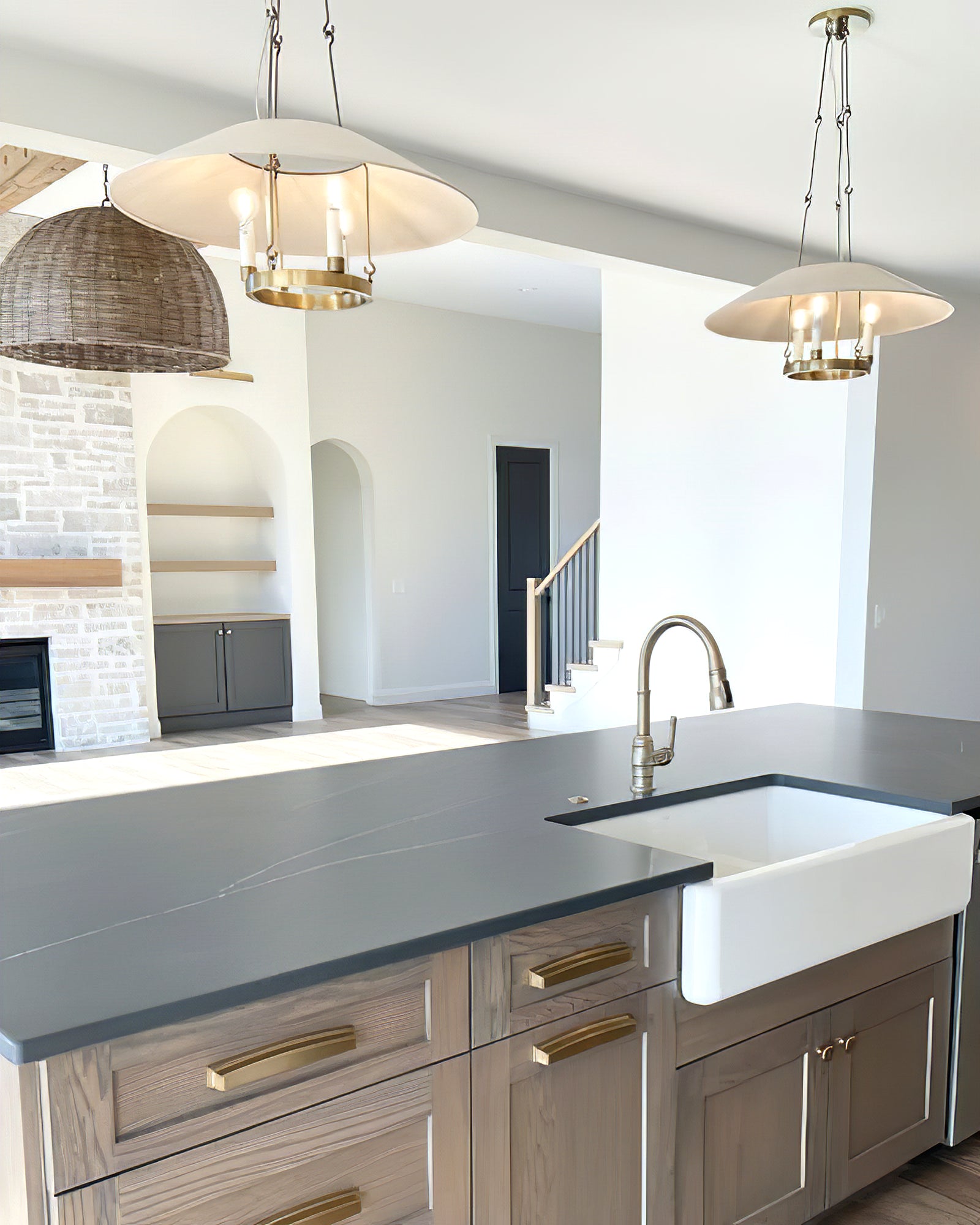 Troy Archive chandeliers above a kitchen island and sink