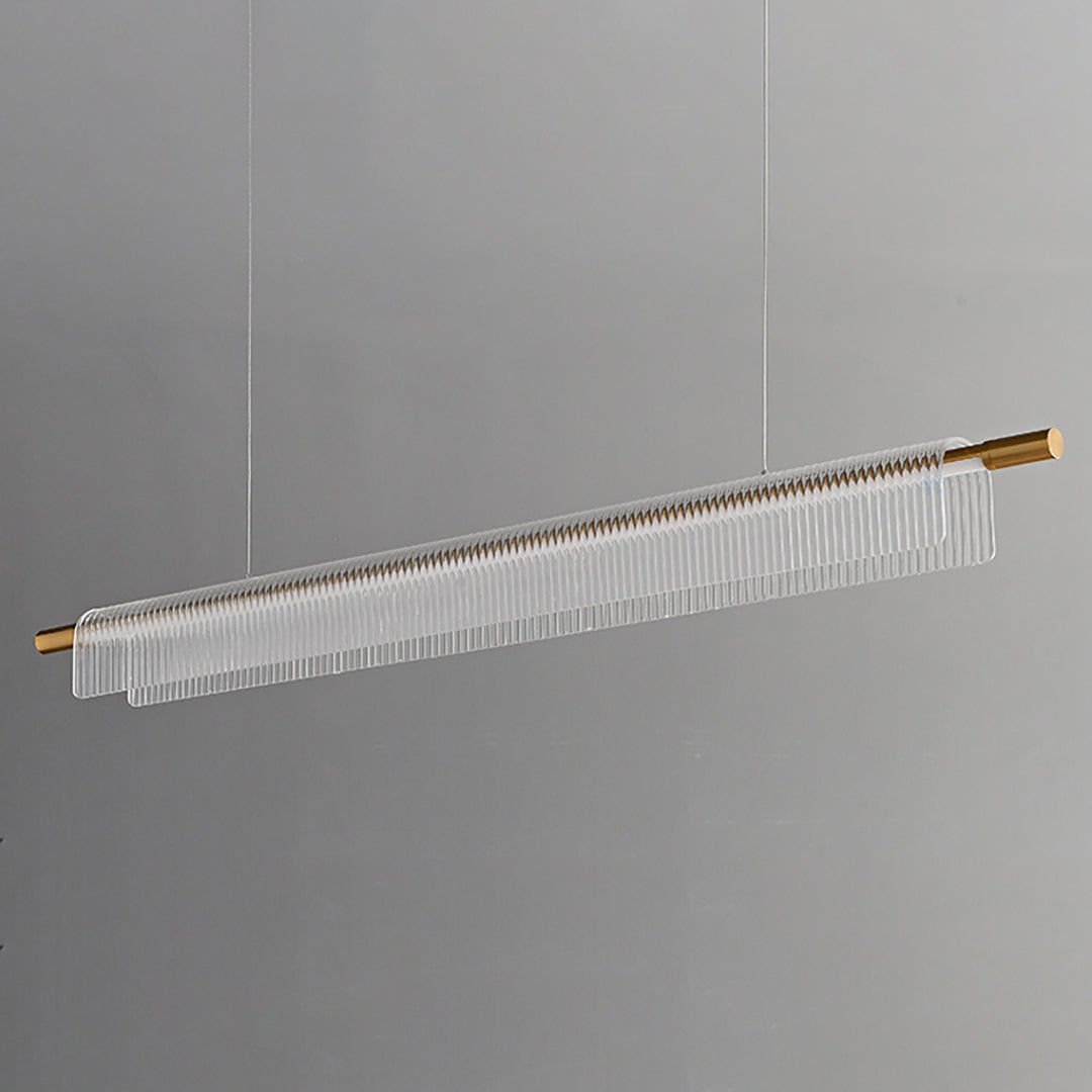 Unlit angled view of clear ribbed acrylic around a gold-tone bar with two suspension lines