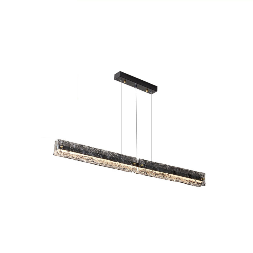 Isolated Capuccio Black + Clear pendant with textured glass bar, black rectangular canopy and thin suspension lines