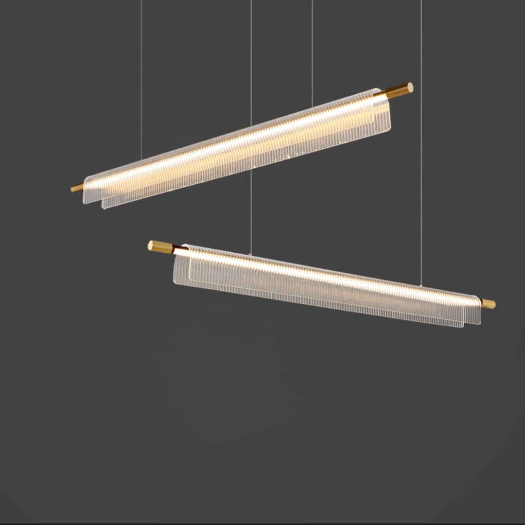 Two illuminated linear pendants arranged at different angles against a dark gray background