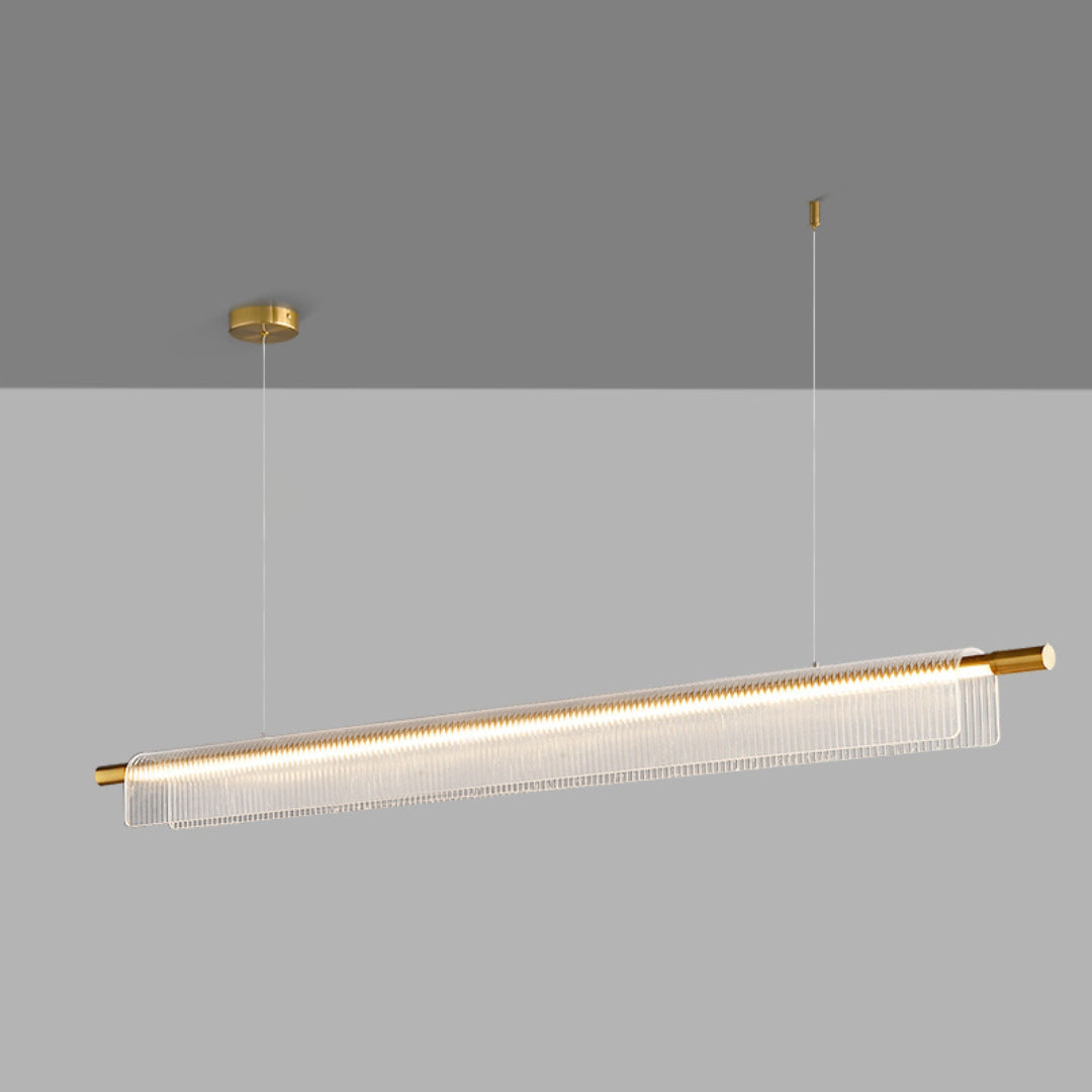 Illuminated gold-tone linear pendant with round canopy, separate ceiling anchor and clear ribbed acrylic on gray
