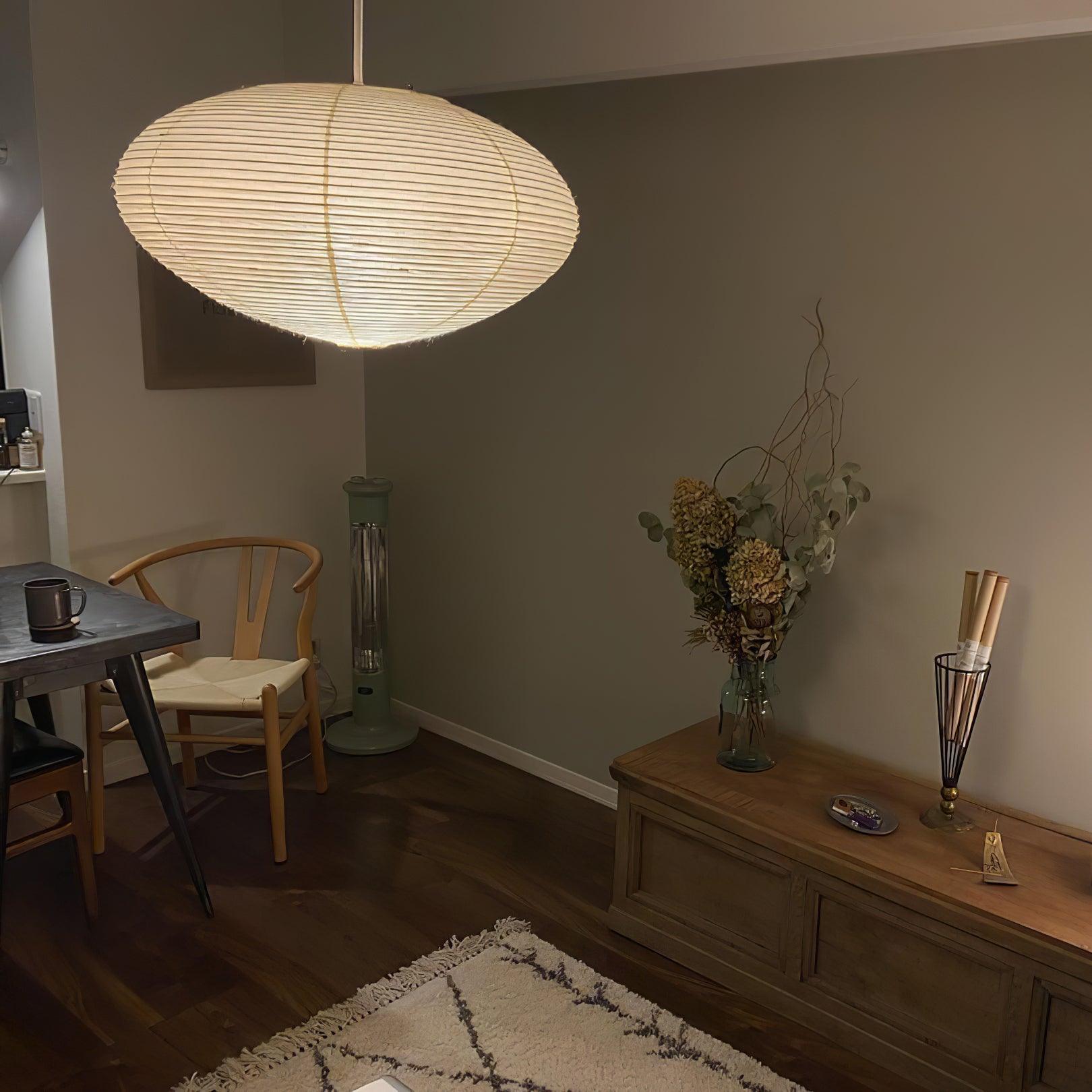 Ribbed paper shade above a living-room corner