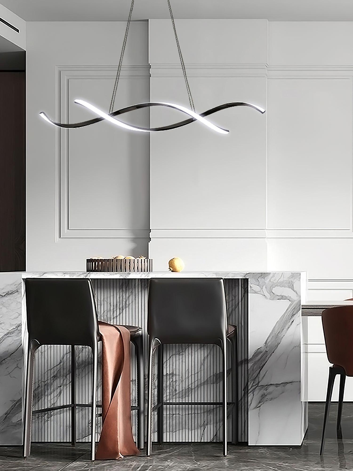 Dark wave pendant with glowing pale strips above a marble bar and tall black stools