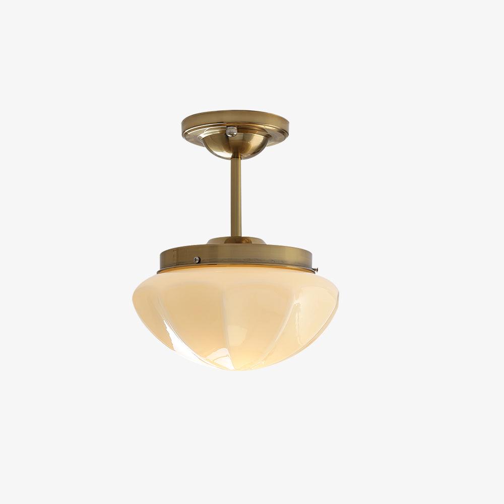 Gold ceiling fitting with illuminated faceted bowl