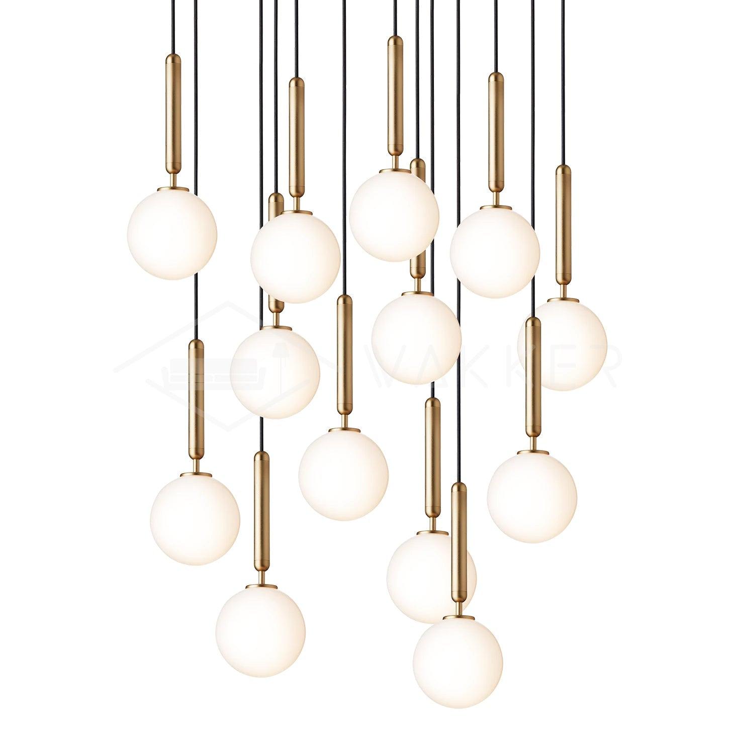 Long cascade of white glass globes with brass stems at staggered heights