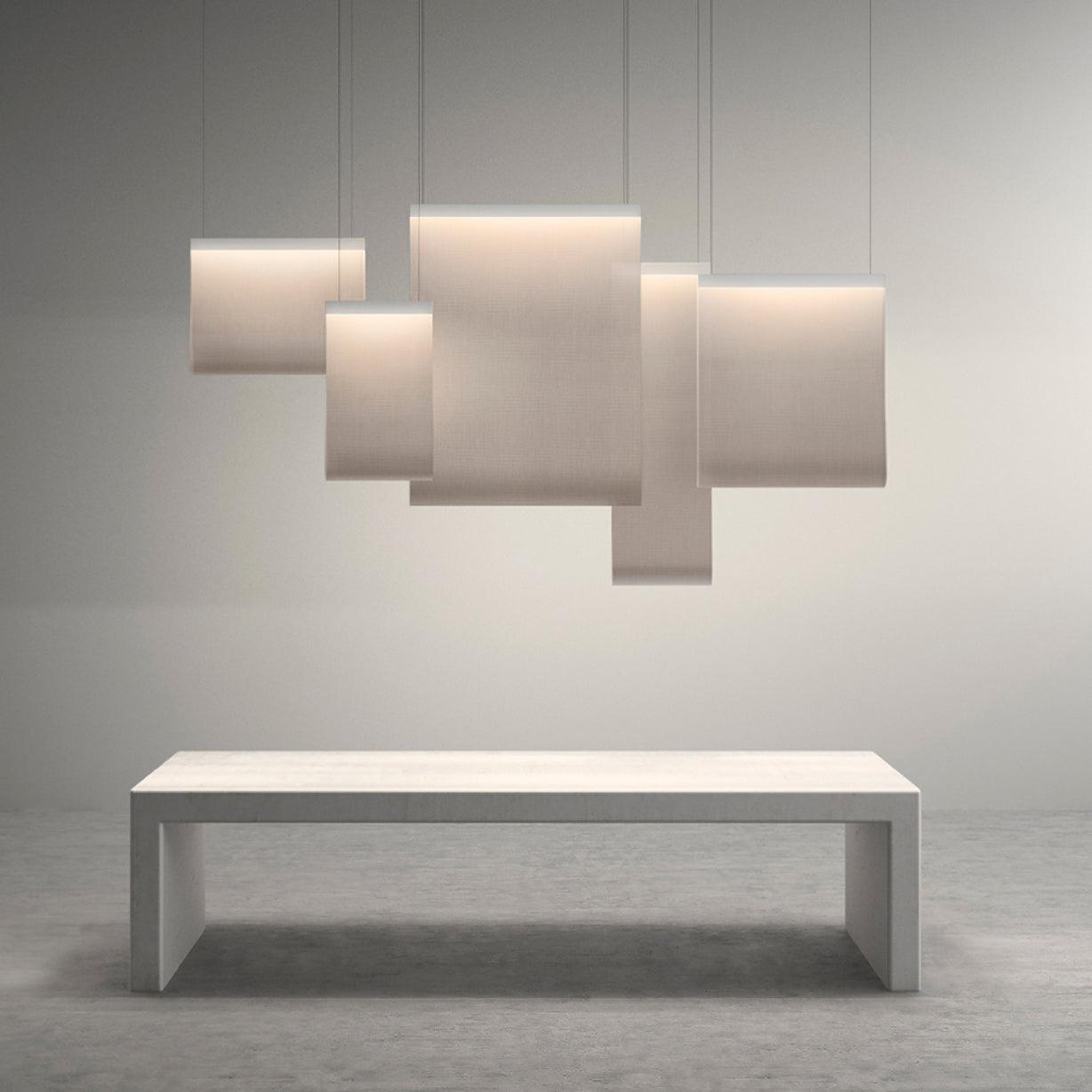 Overlapping rectangular light panels above a white bench