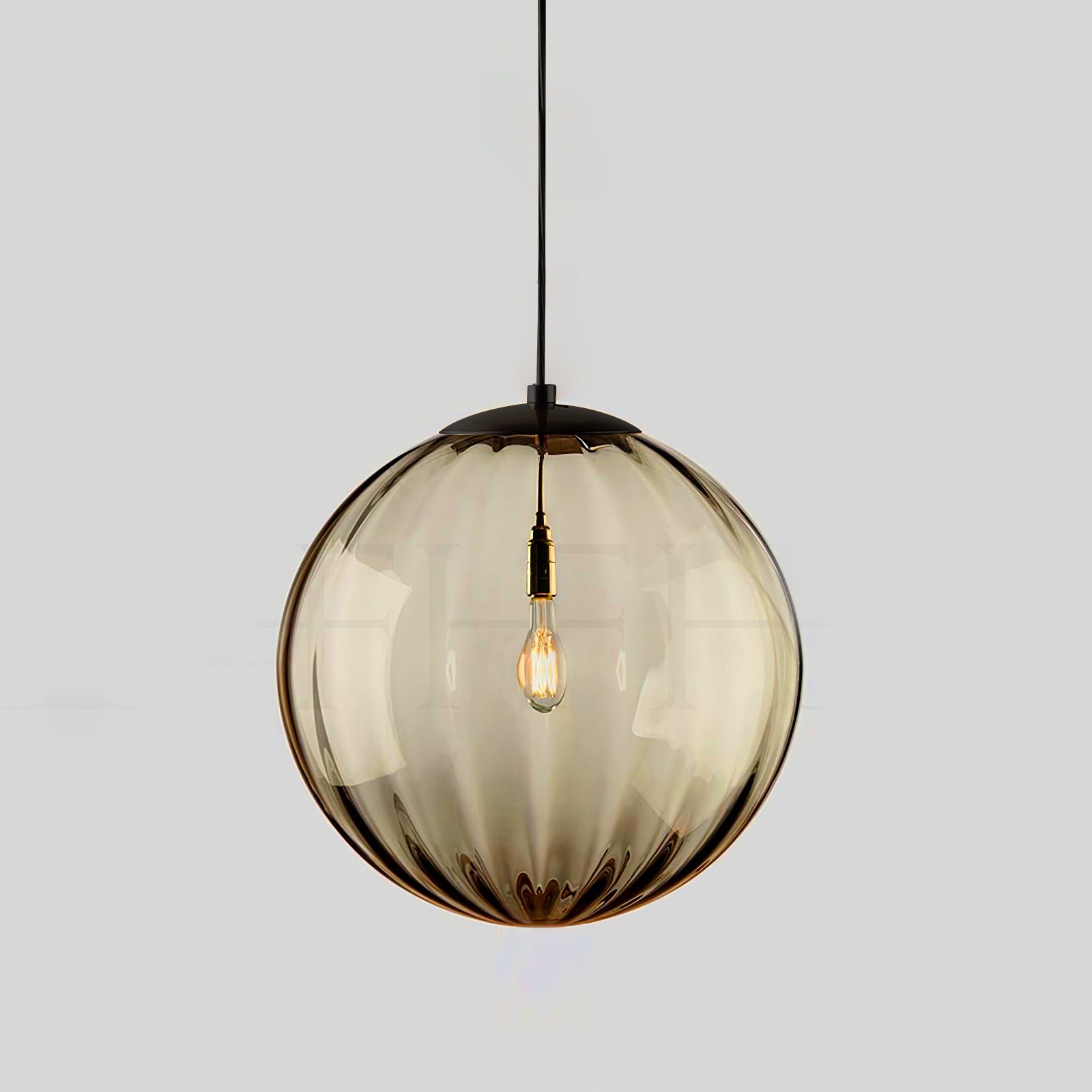 Paola pendant light with a coloured glass globe and small metal cap