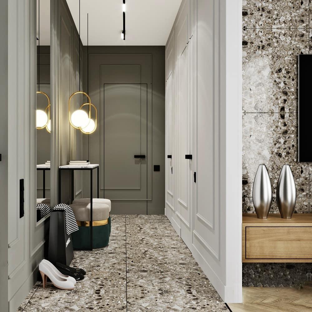 Round frame pendants in an entryway setting