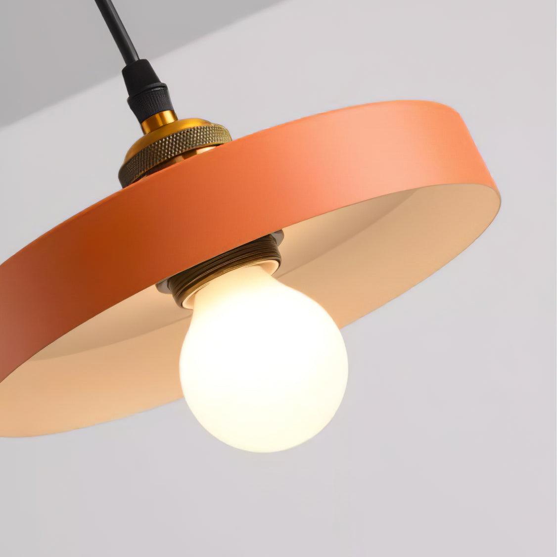Orange shallow disc with a bulb underneath