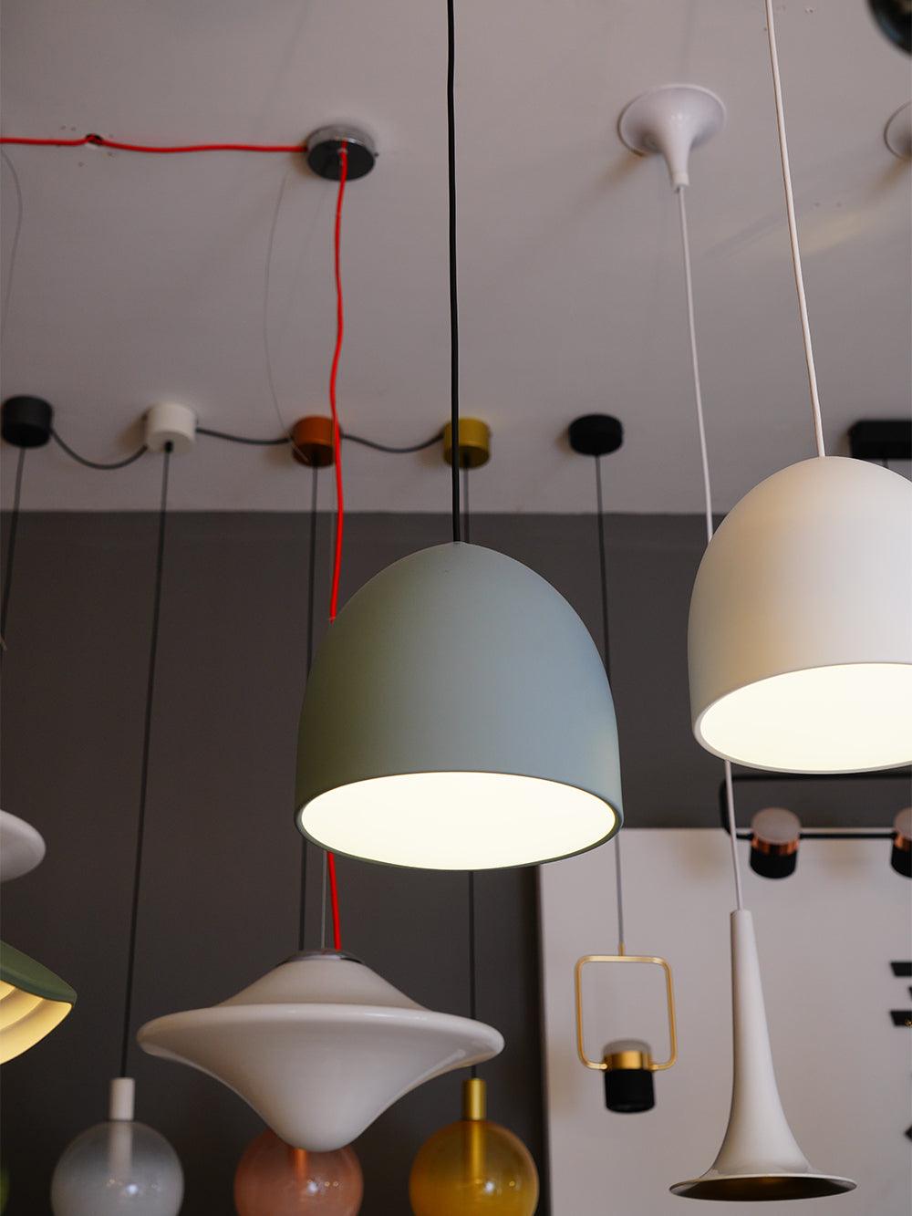 Bell pendants and other fixture shapes in a showroom