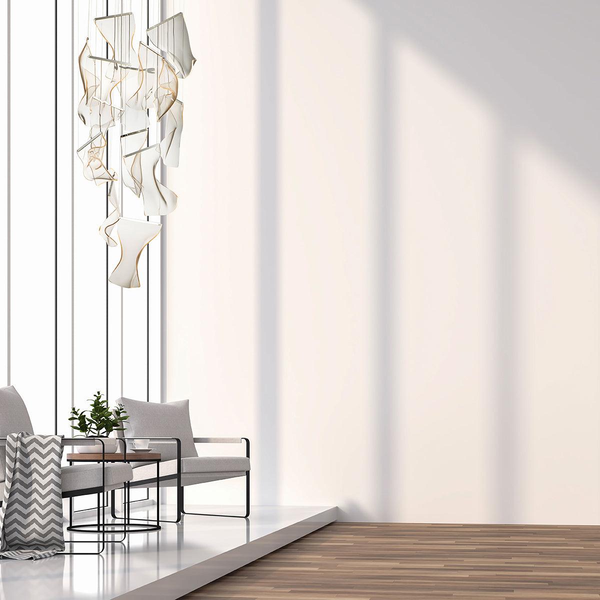 Long acrylic cascade beside a tall window