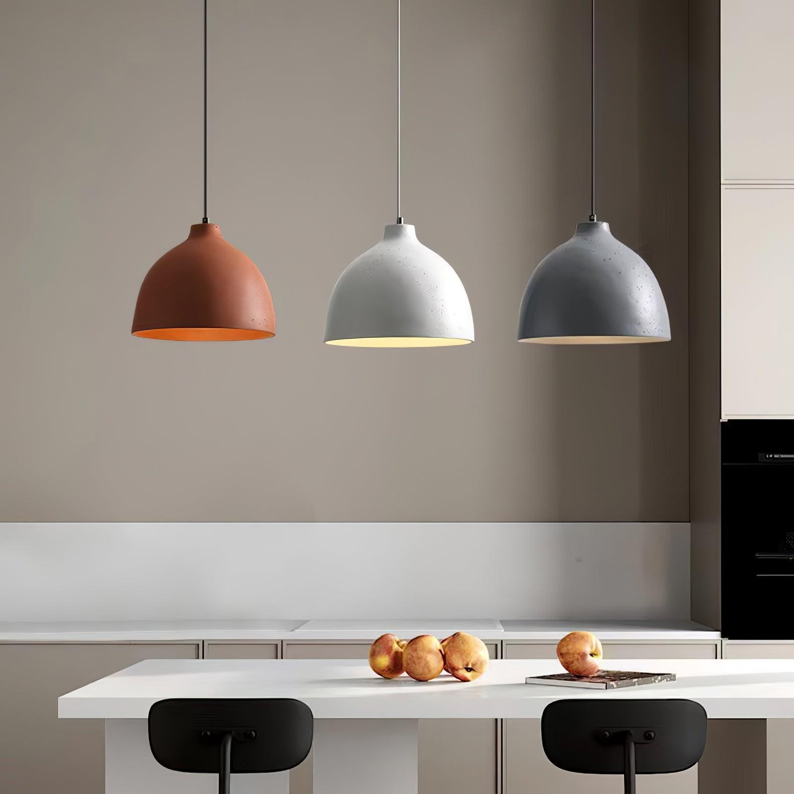 Orange white and grey pendants above a counter