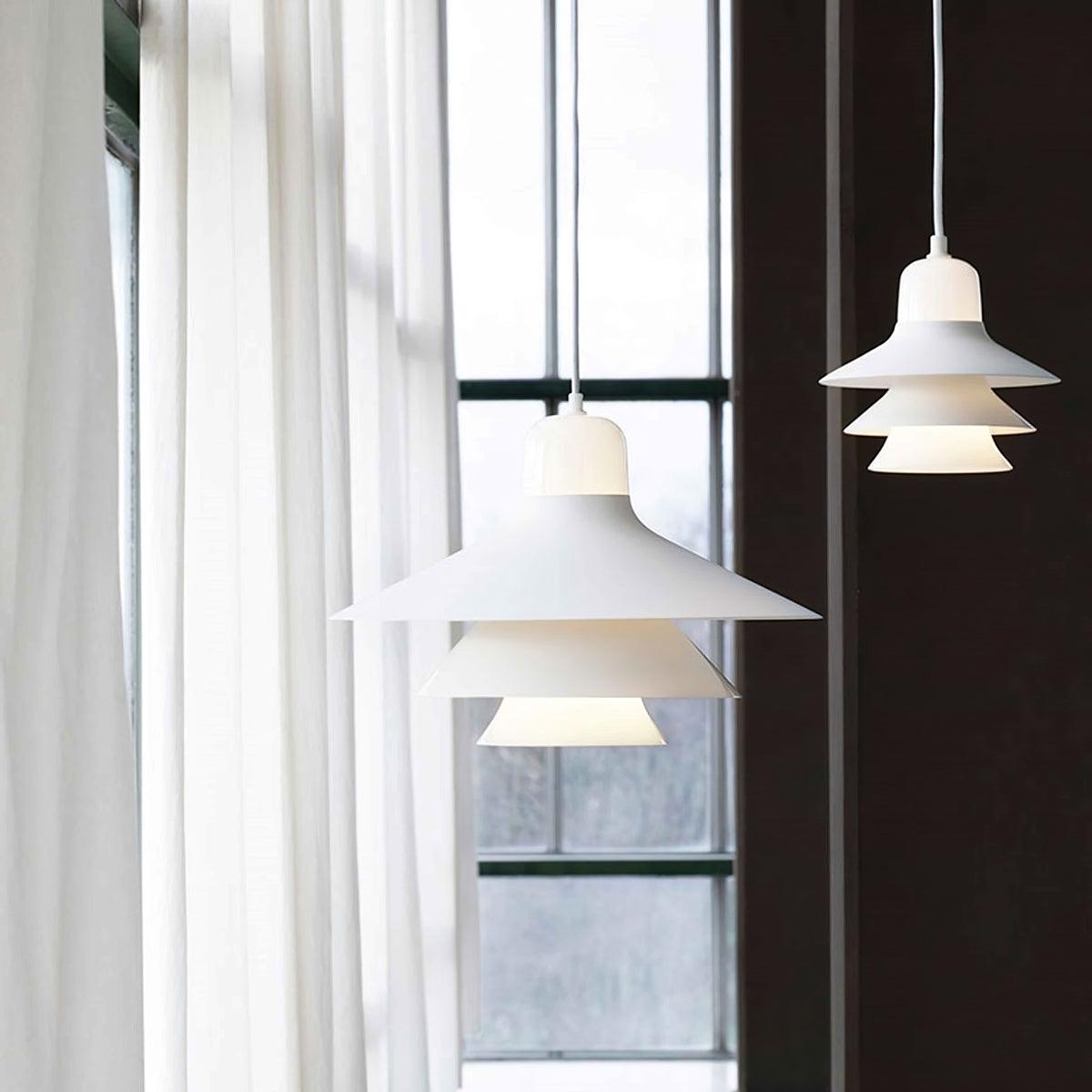 Large and small White pendants near a window