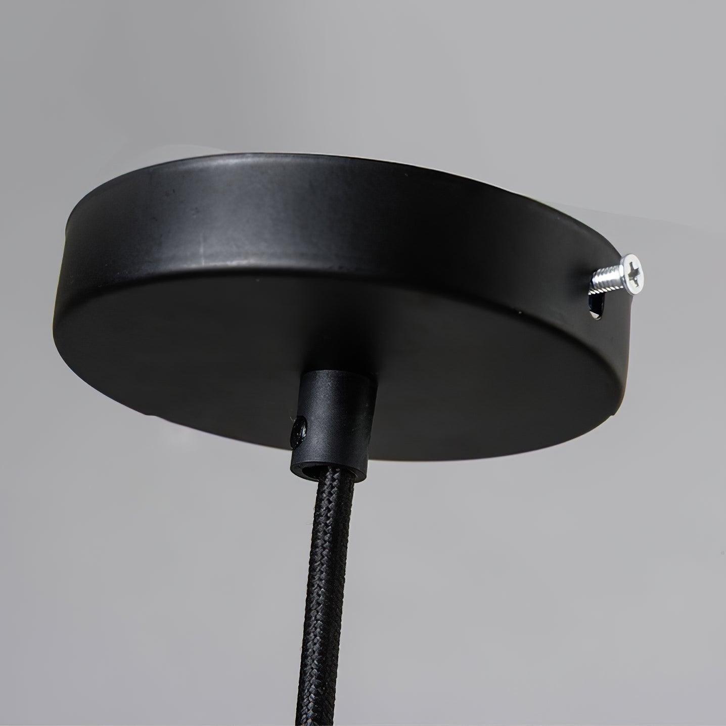 Black circular canopy and fabric-textured hanging cable