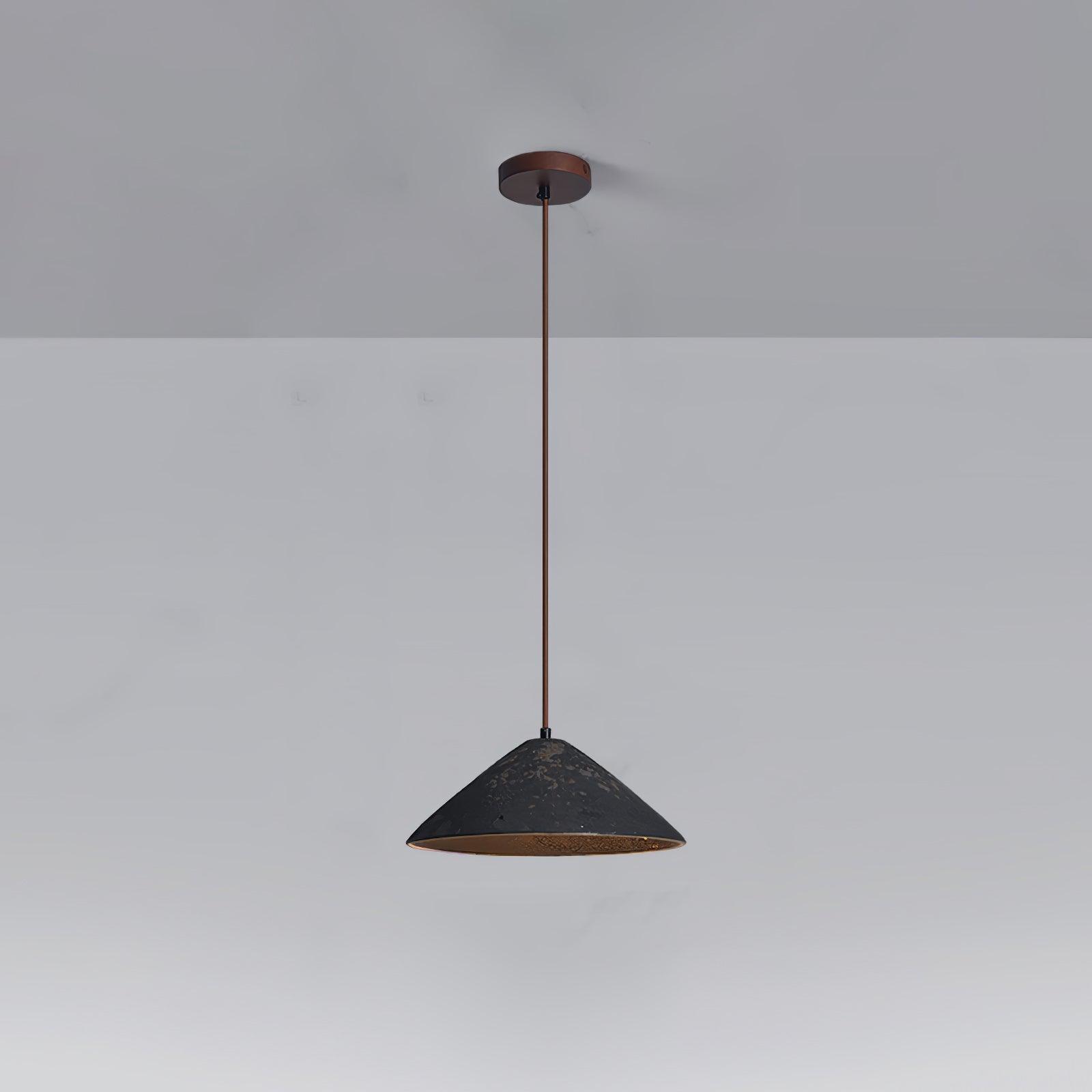 Black ceramic cone pendant with brown mottled marks, long brown cord and round dark-brown canopy on grey