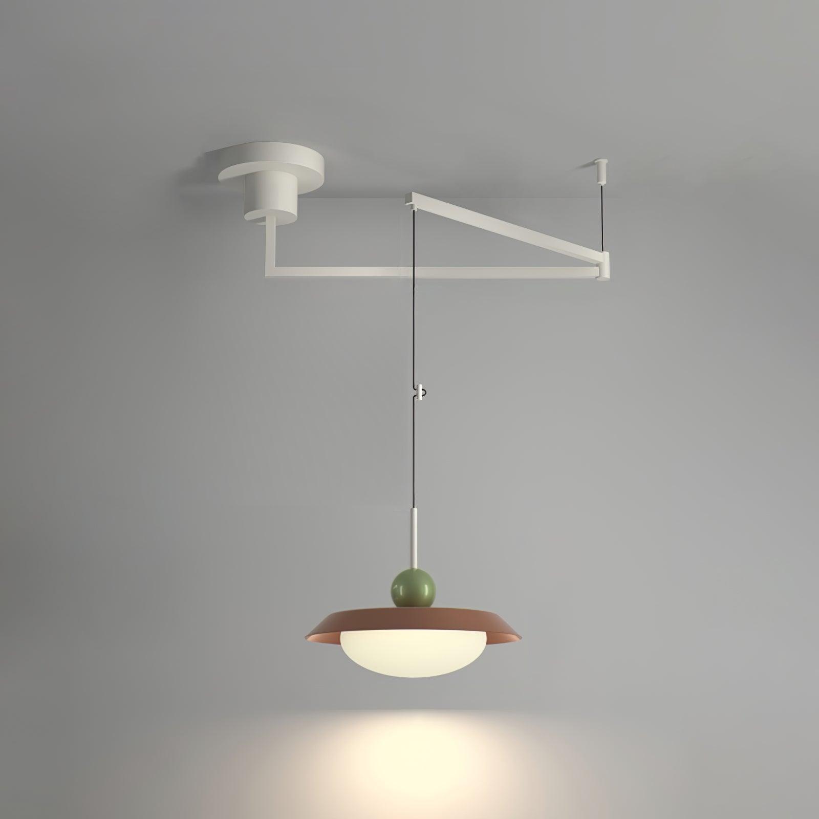 Red single-layer Morandi pendant with a green sphere on a white ceiling swing arm