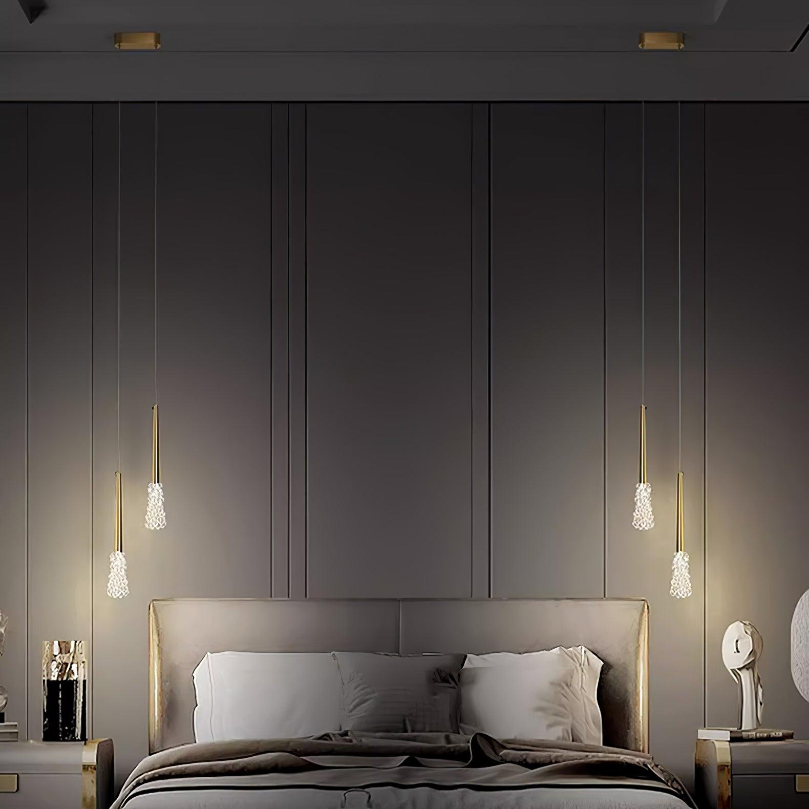 Paired Gold pendants beside a bed