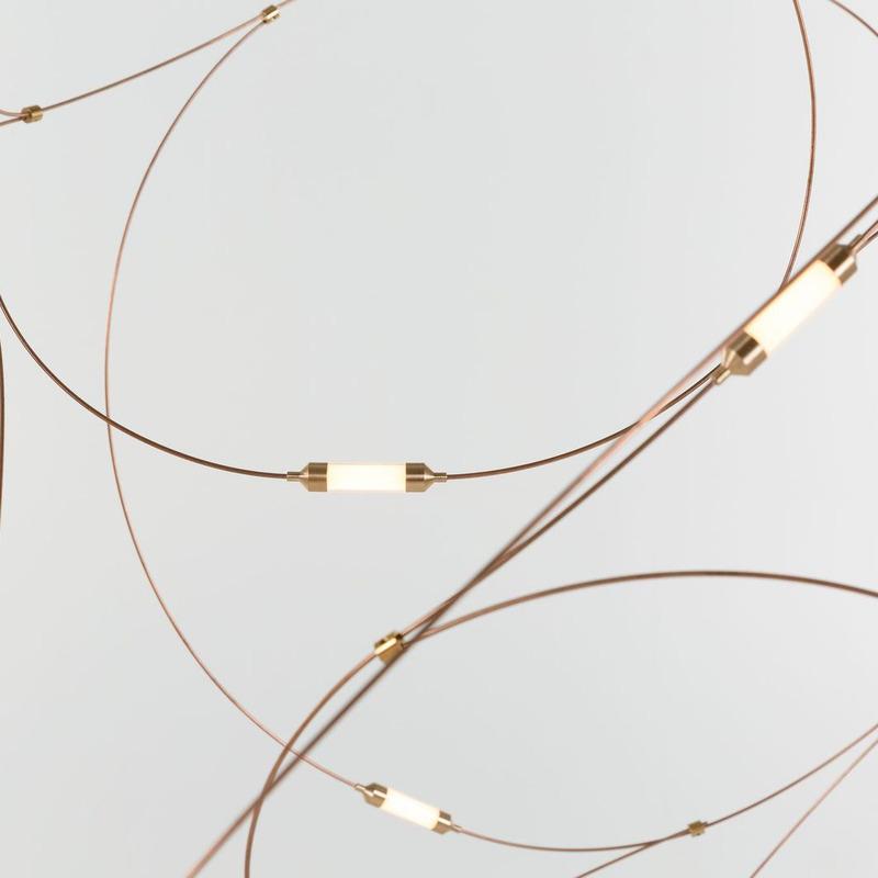 Close curved wire loops with glowing cylindrical diffusers and small metal connectors