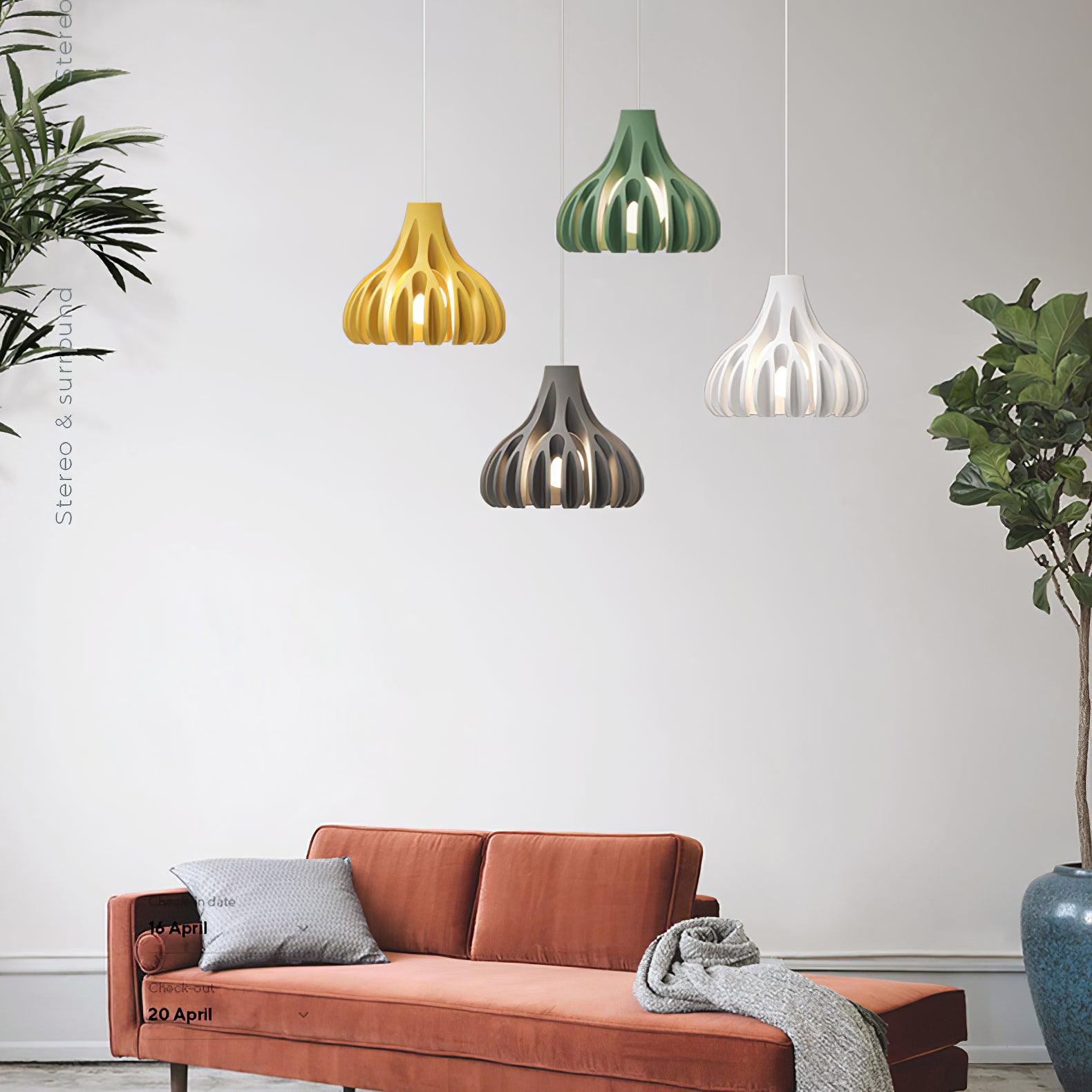 Four coloured resin pendants above a sofa