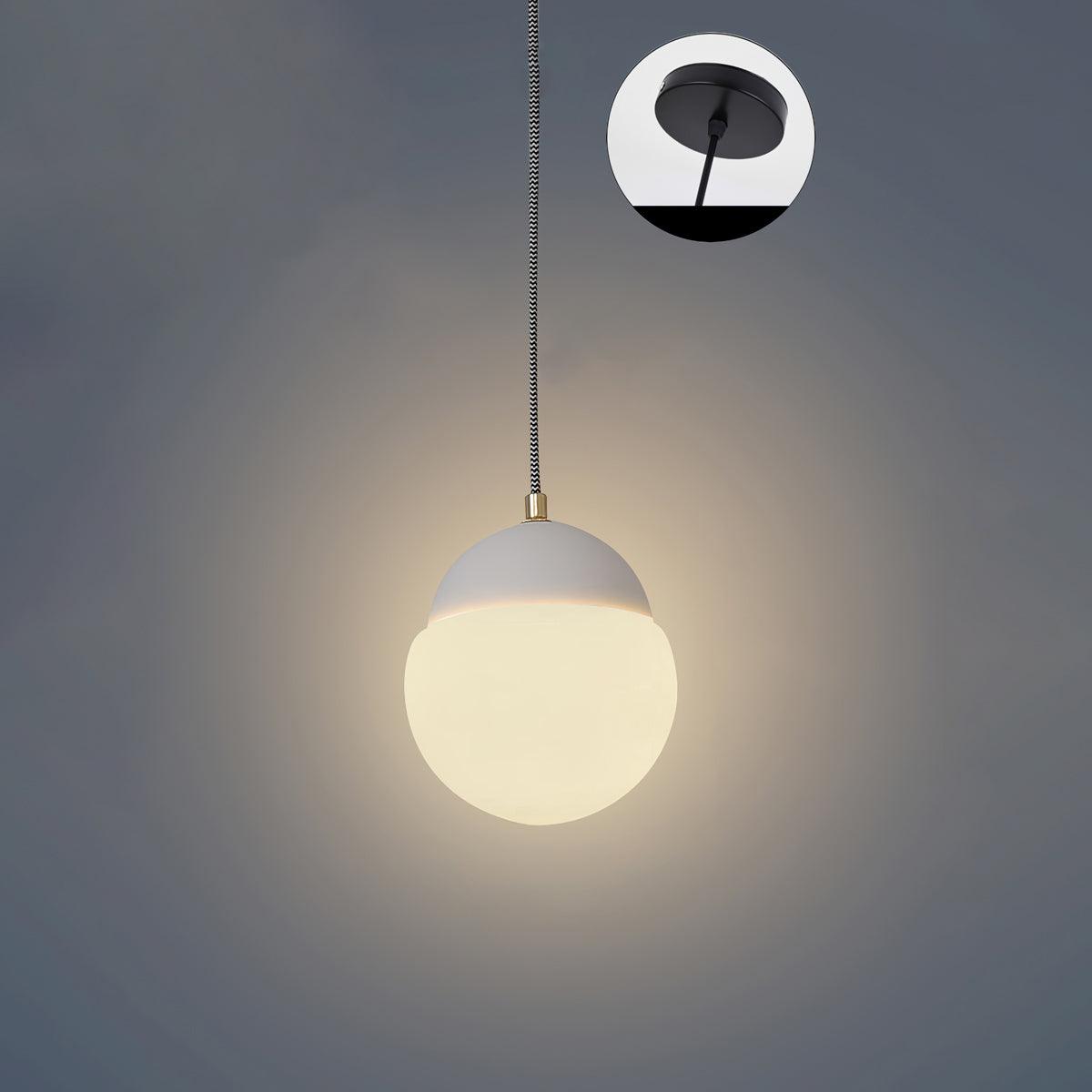 Cement Eclipse pendant light with a white cap and rounded lower shade