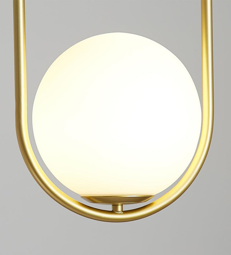 Close detail of illuminated globe and brass-coloured oval frame