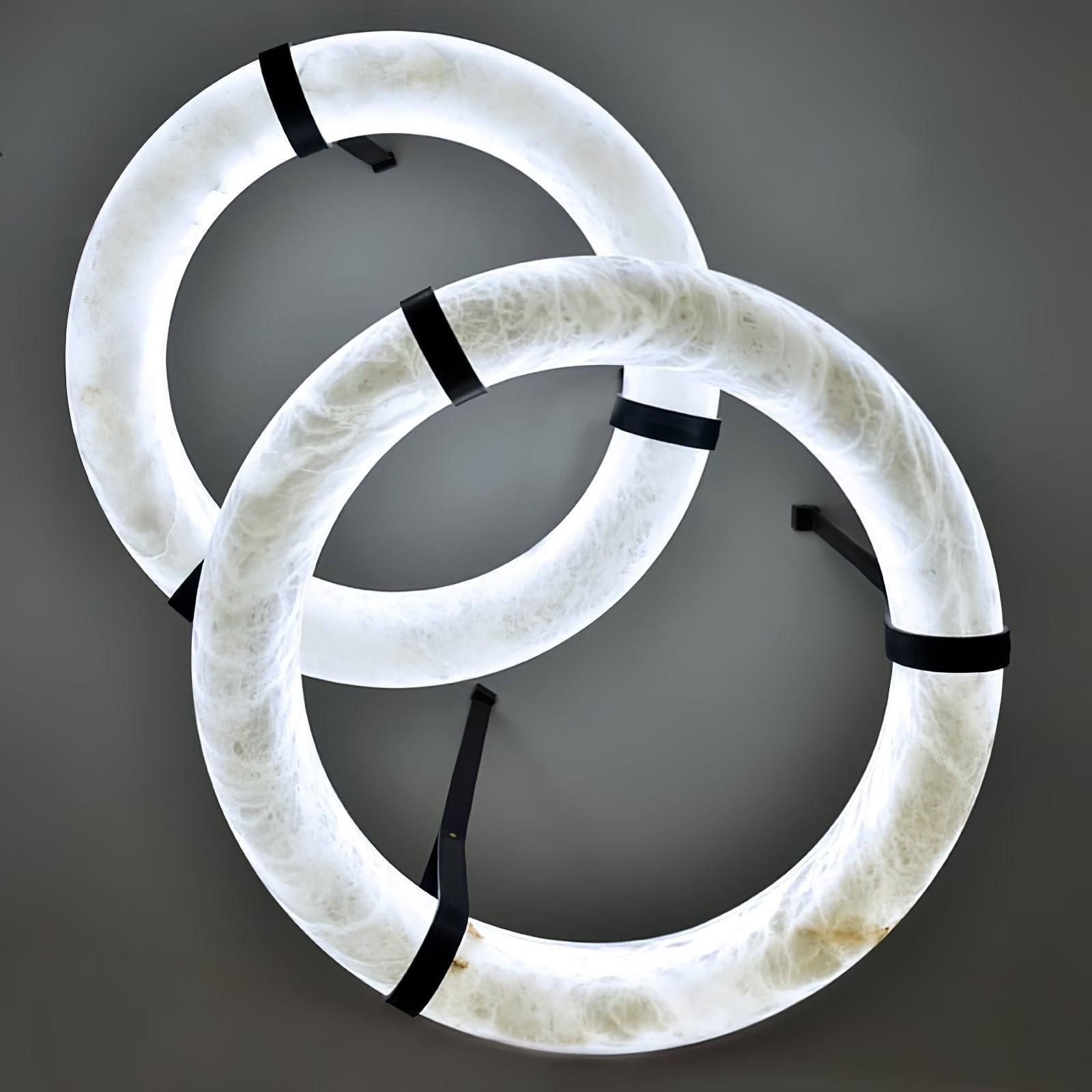 Two glowing alabaster rings viewed from below